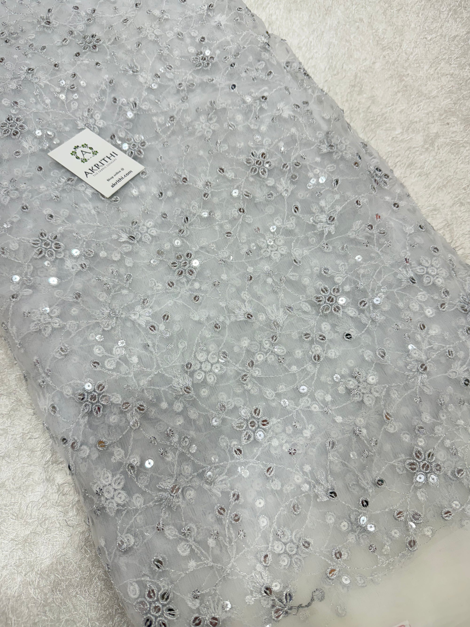 Embroidered net fabric