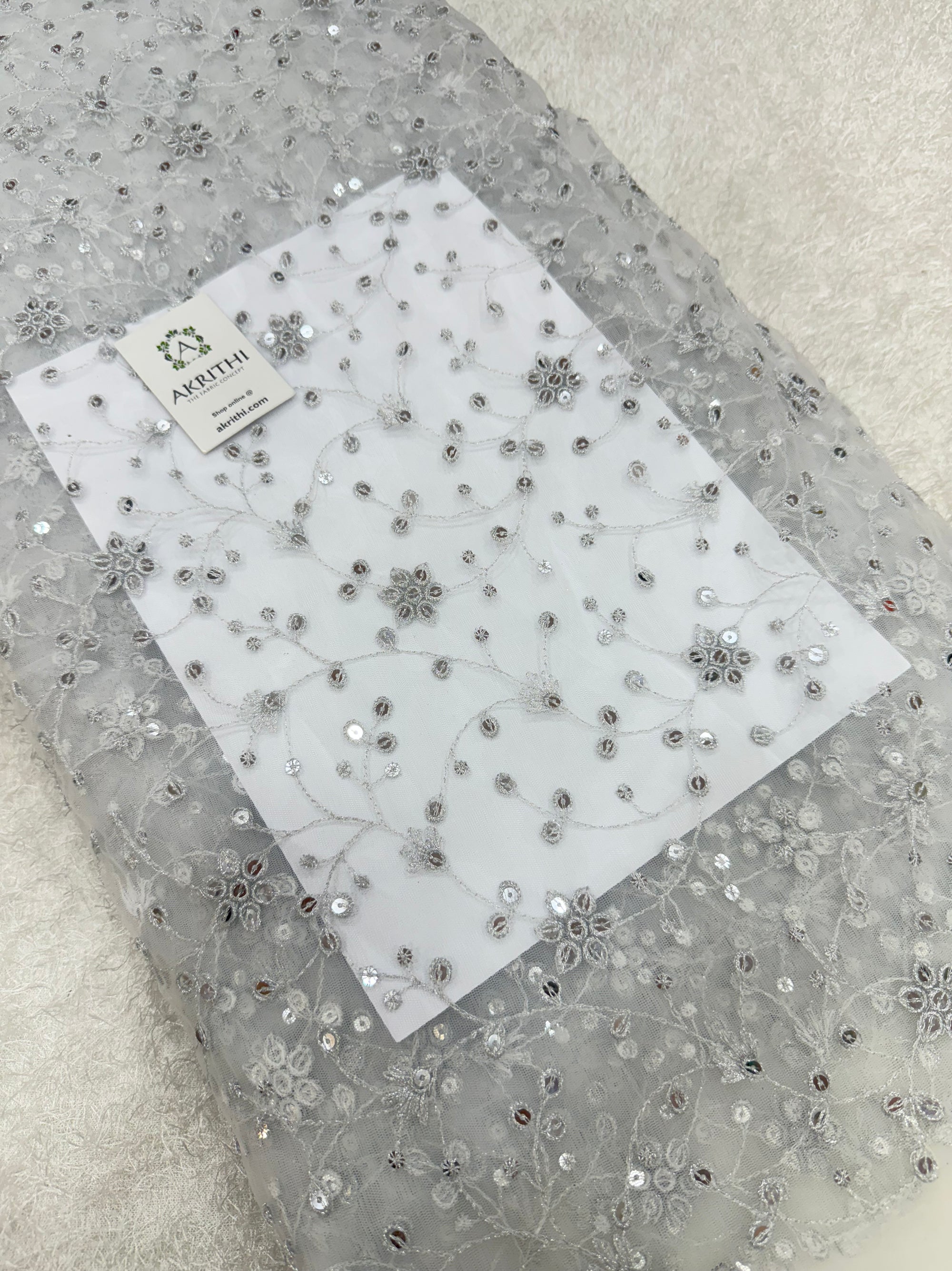 Embroidered net fabric