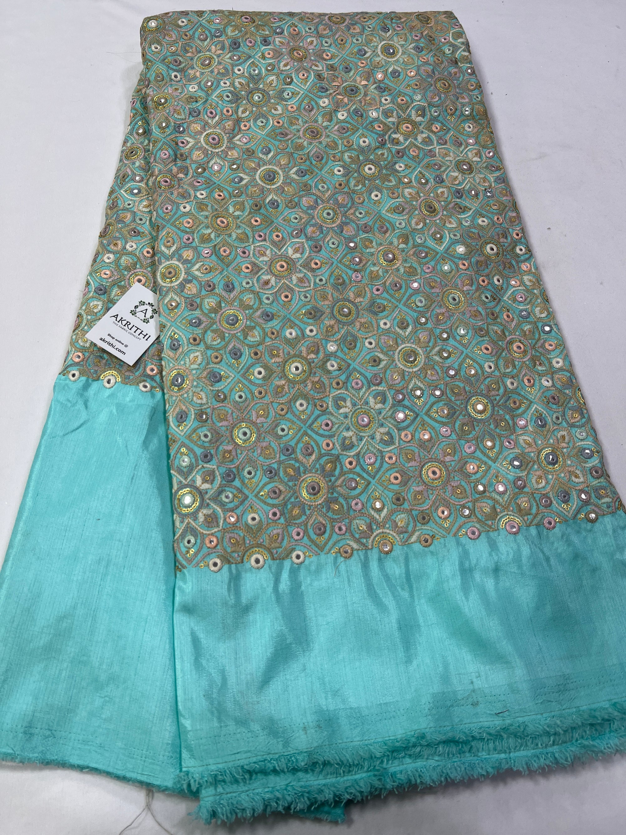 Heavy Embroidery on blue raw silk fabric