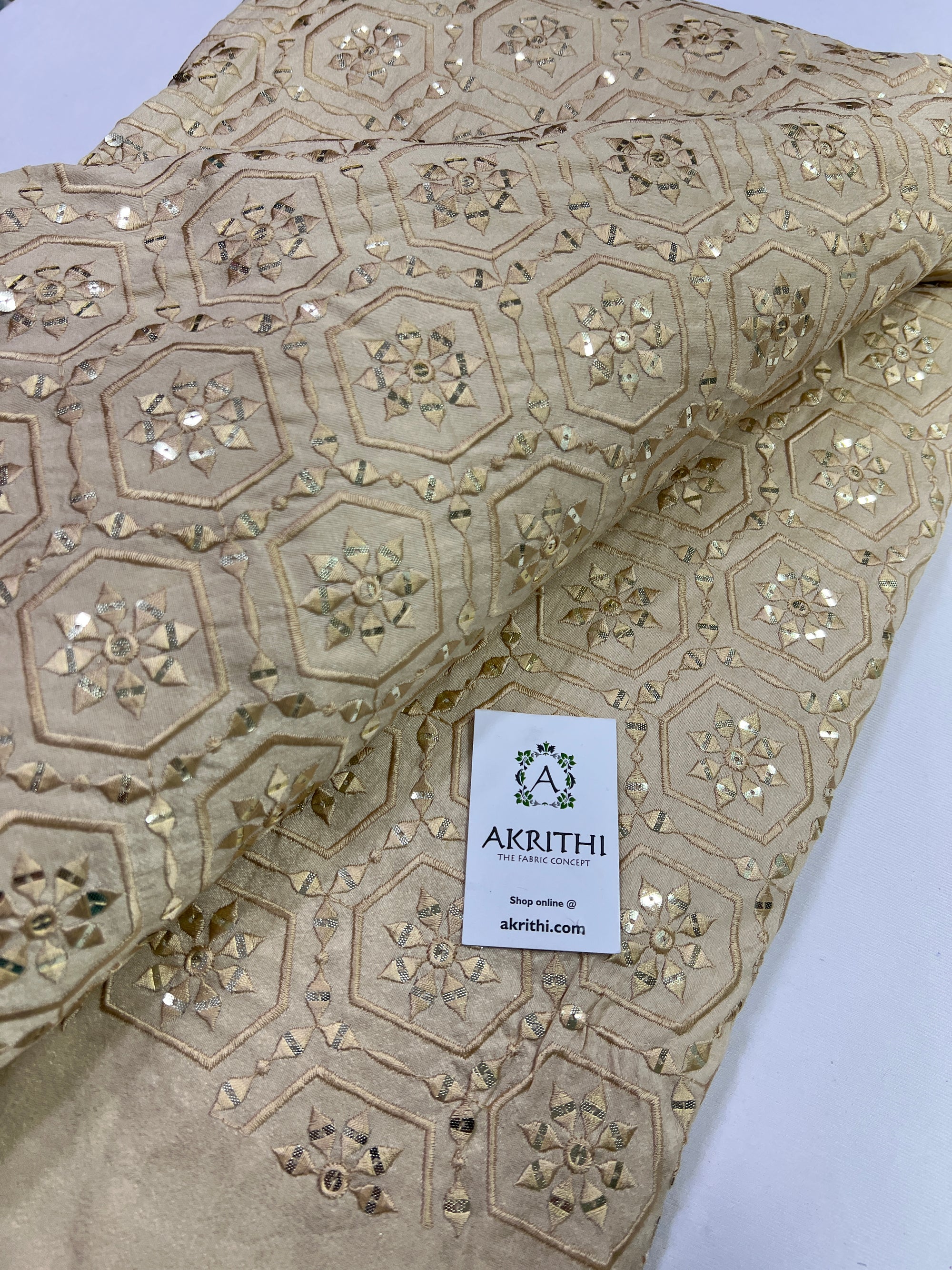 Embroidery on raw silk fabric