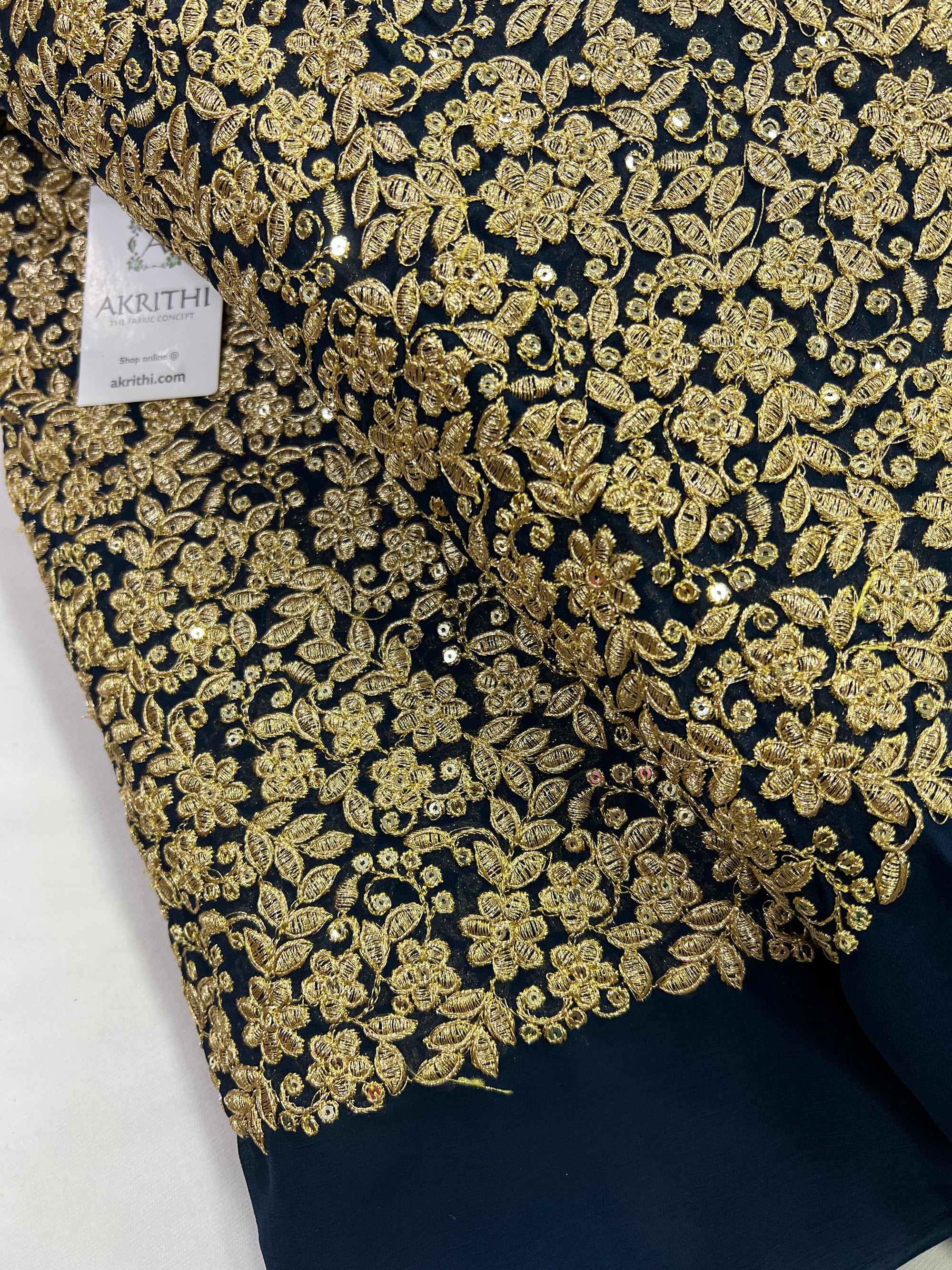 Embroidery on peacock blue georgette fabric