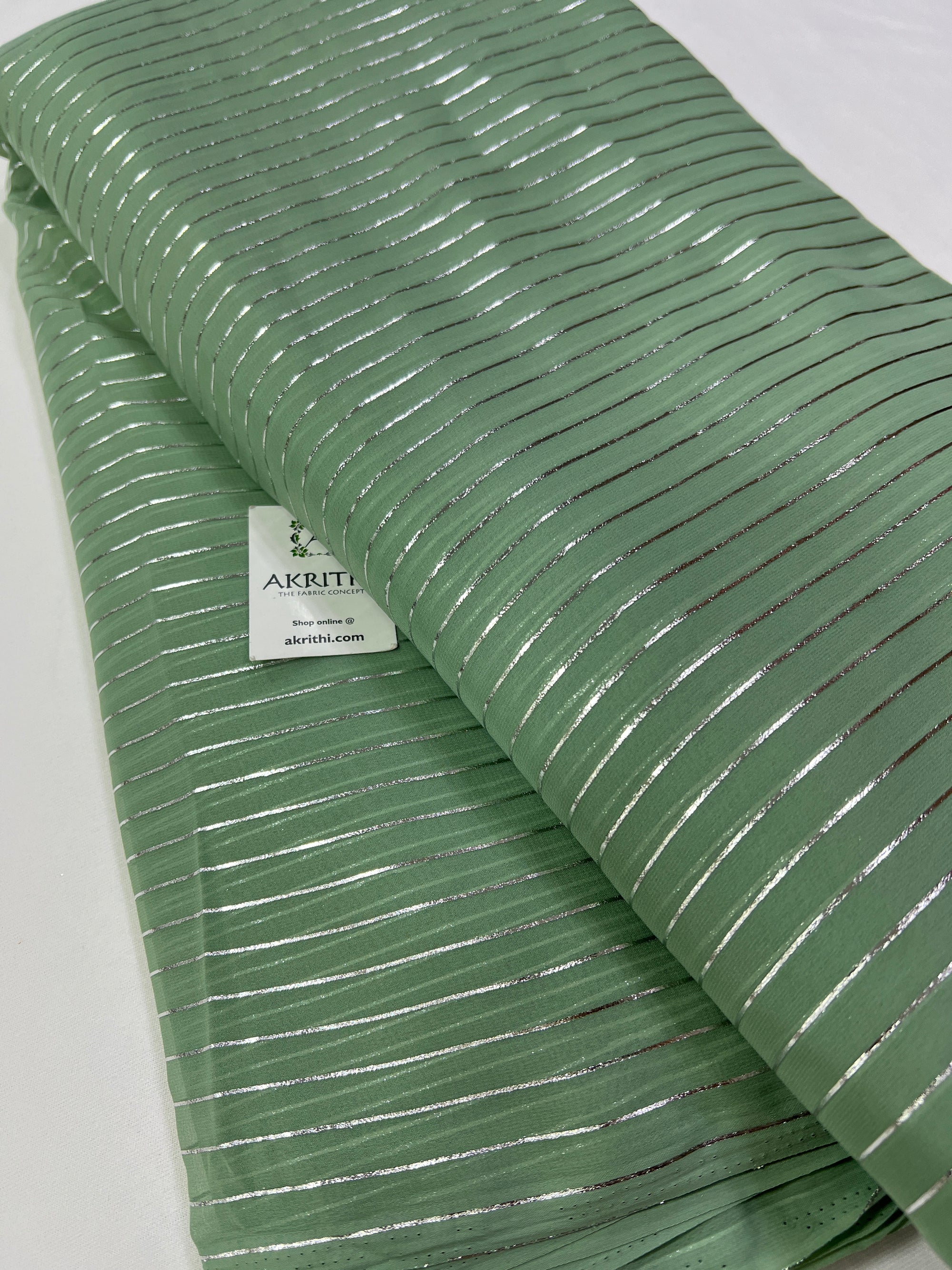 Foil printed slate green georgette fabric