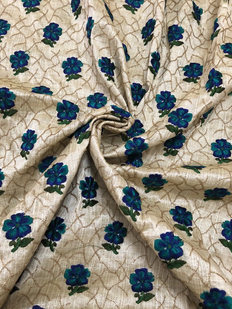Thread and sequins embroidery on beige raw silk blouse