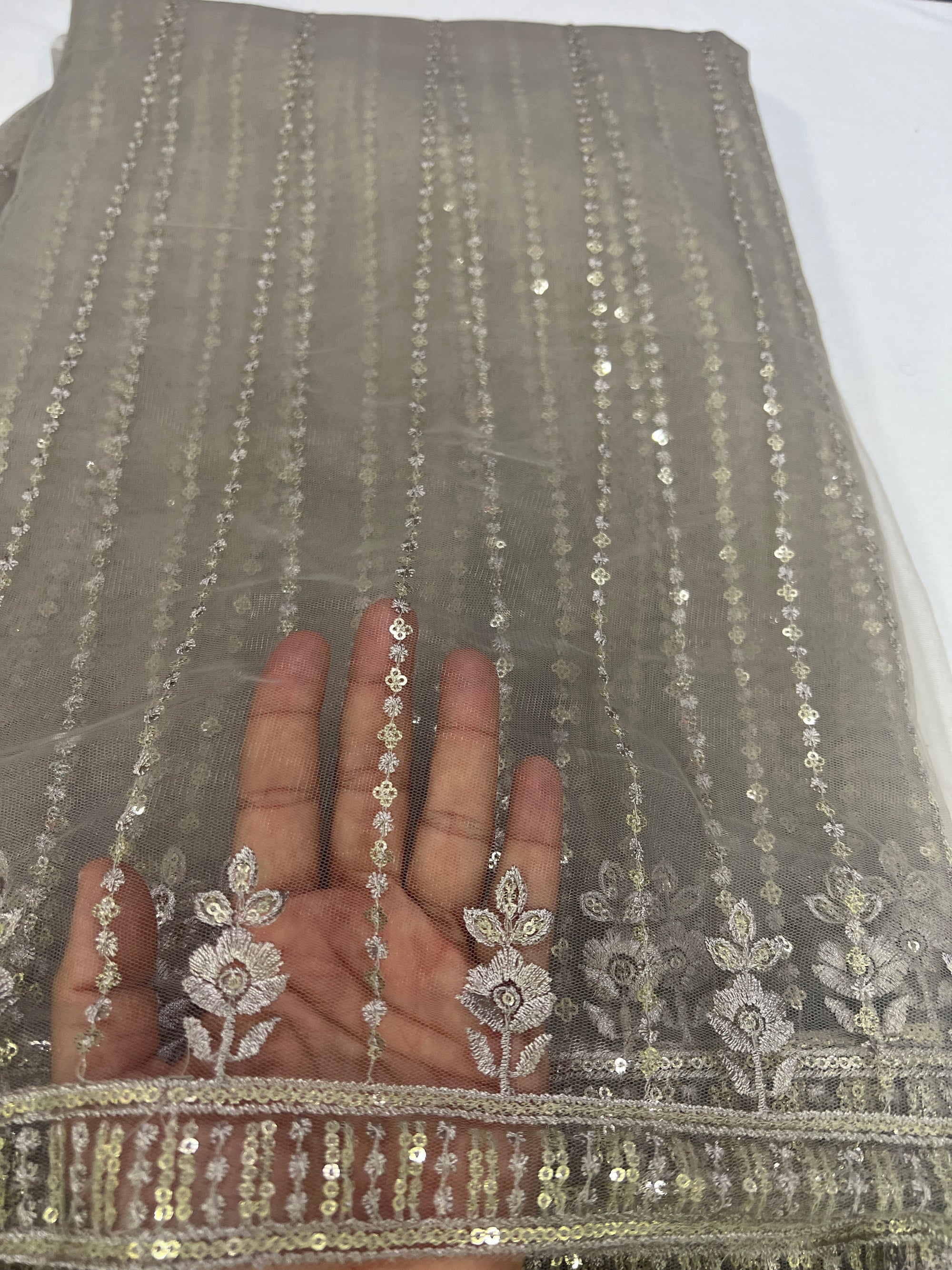 Embroidery on net fabric