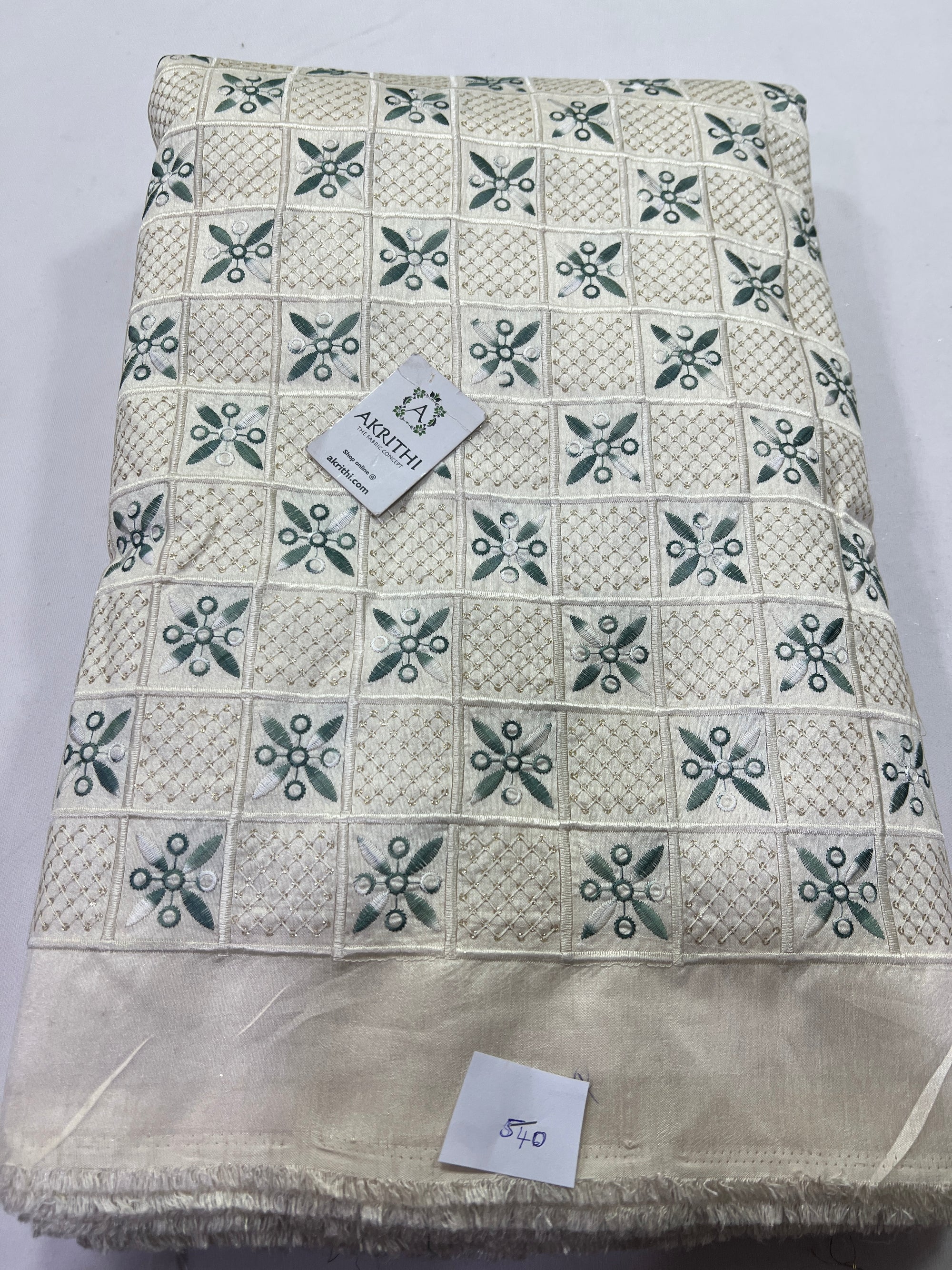 Embroidery on raw silk fabric