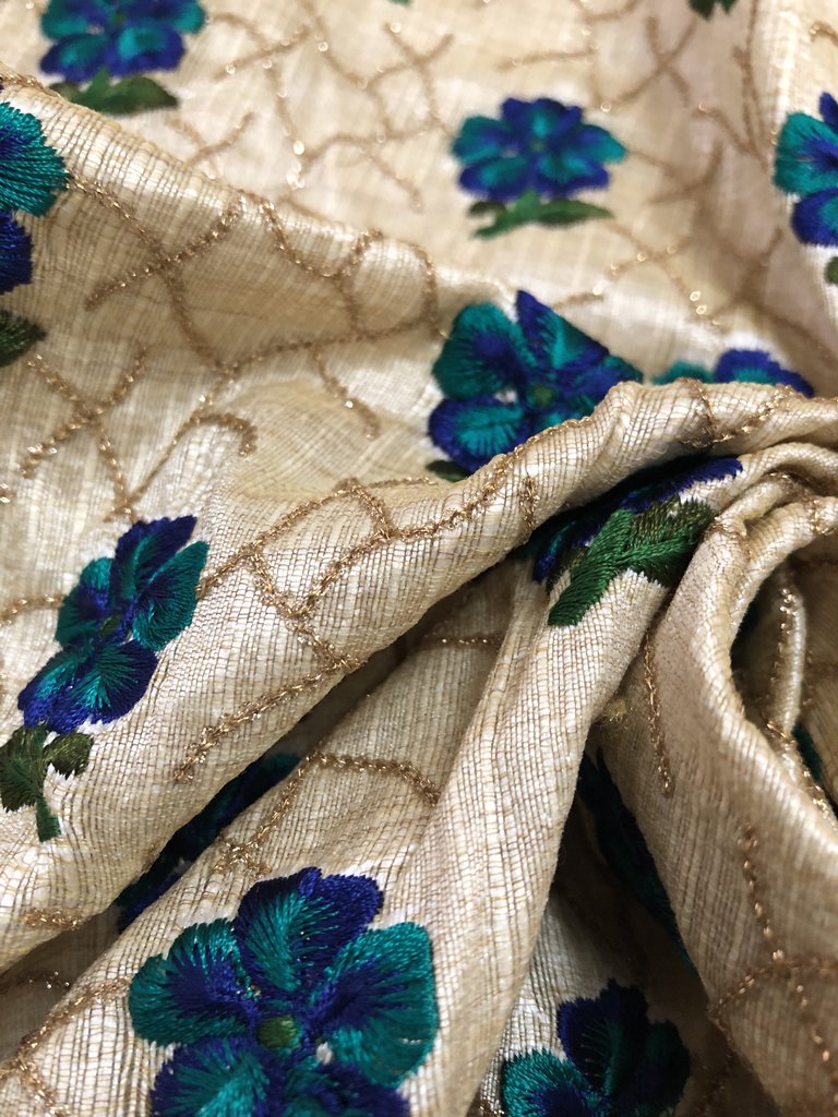 Thread and sequins embroidery on beige raw silk blouse