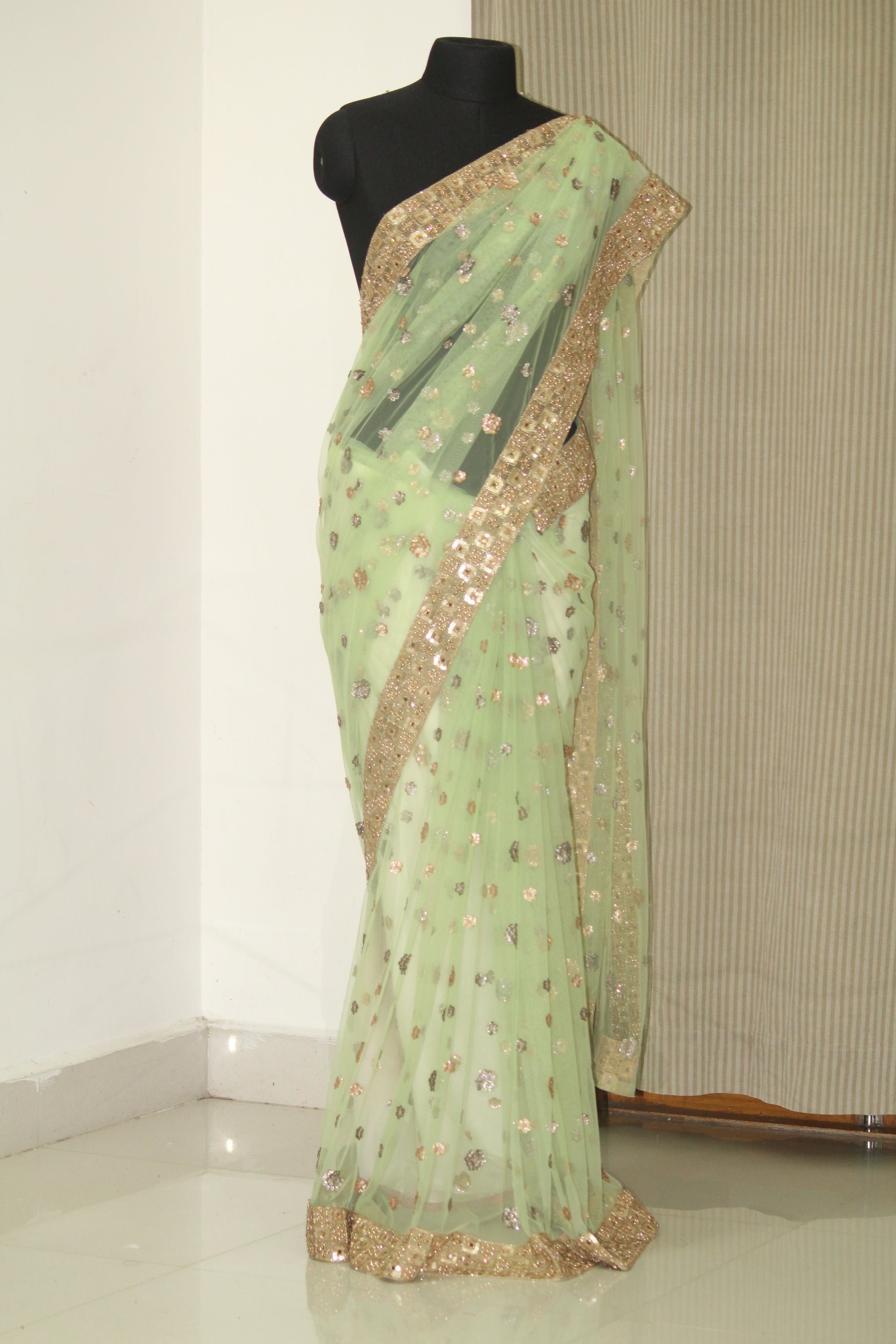Green net butti saree