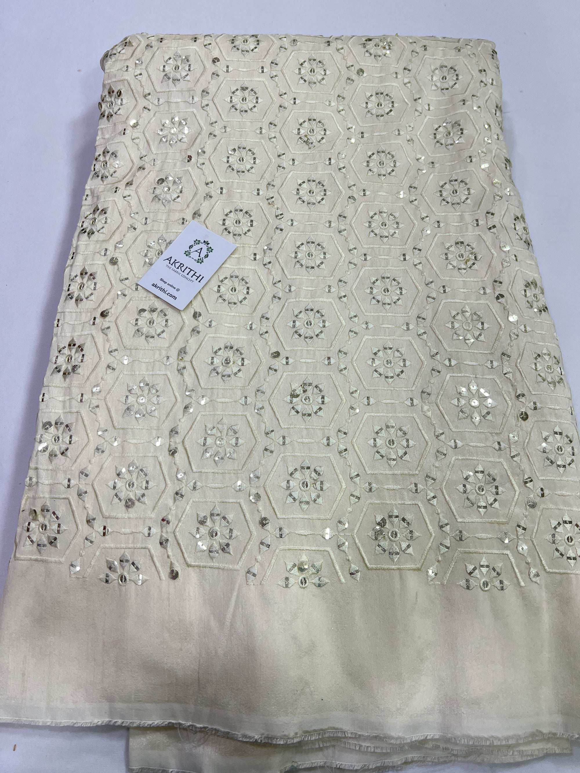 Embroidery on raw silk fabric