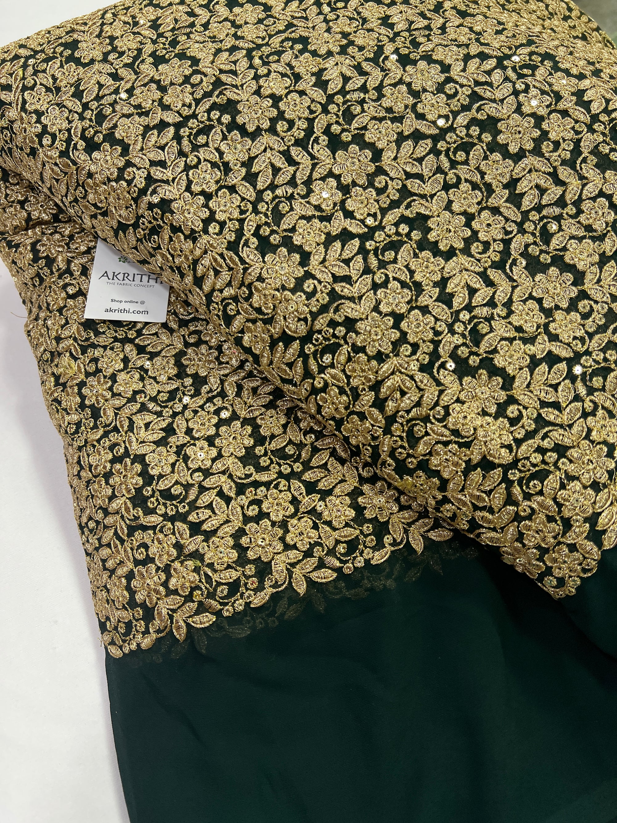 Embroidery on dark green georgette fabric
