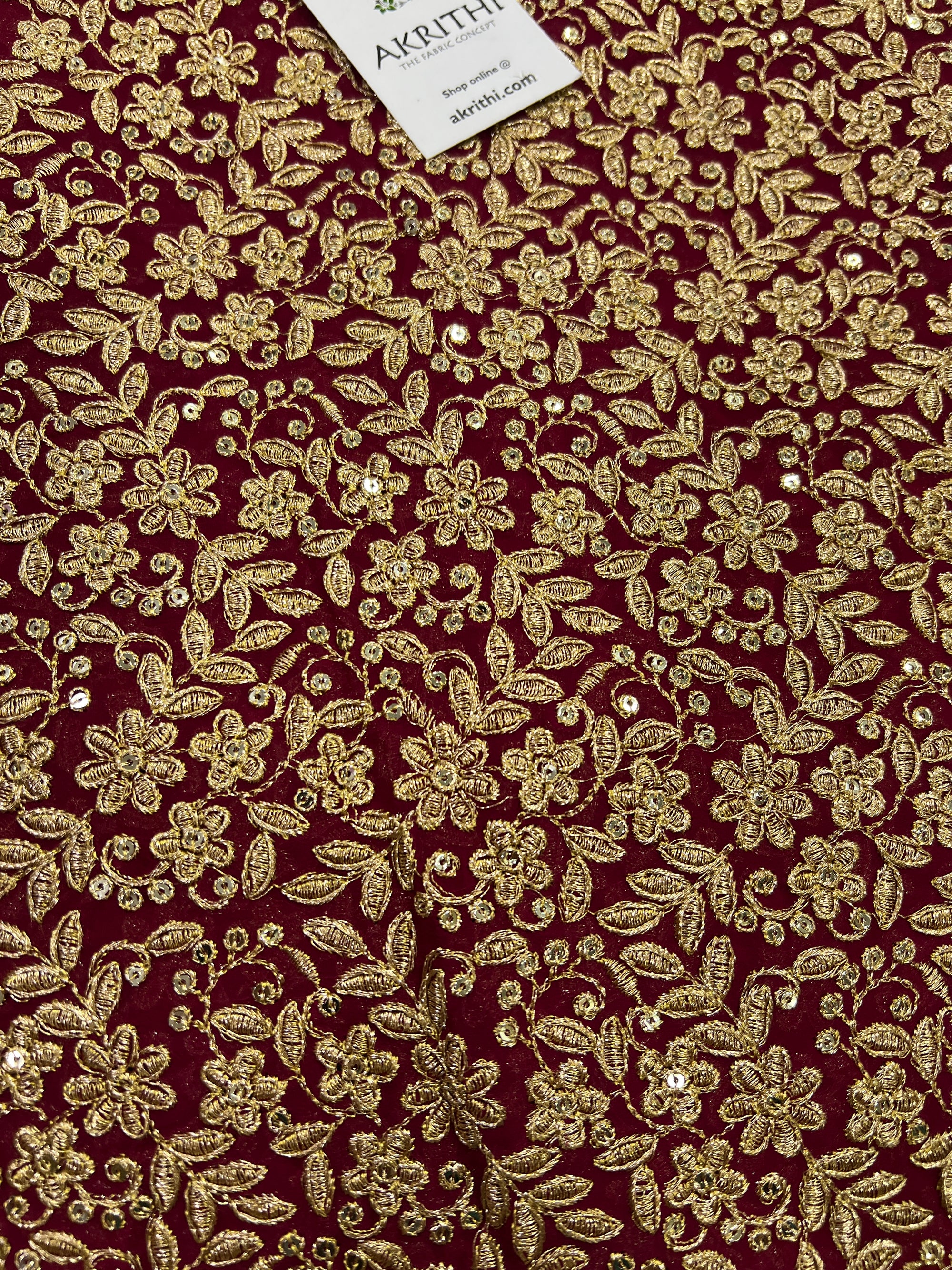 Embroidery on pink georgette fabric