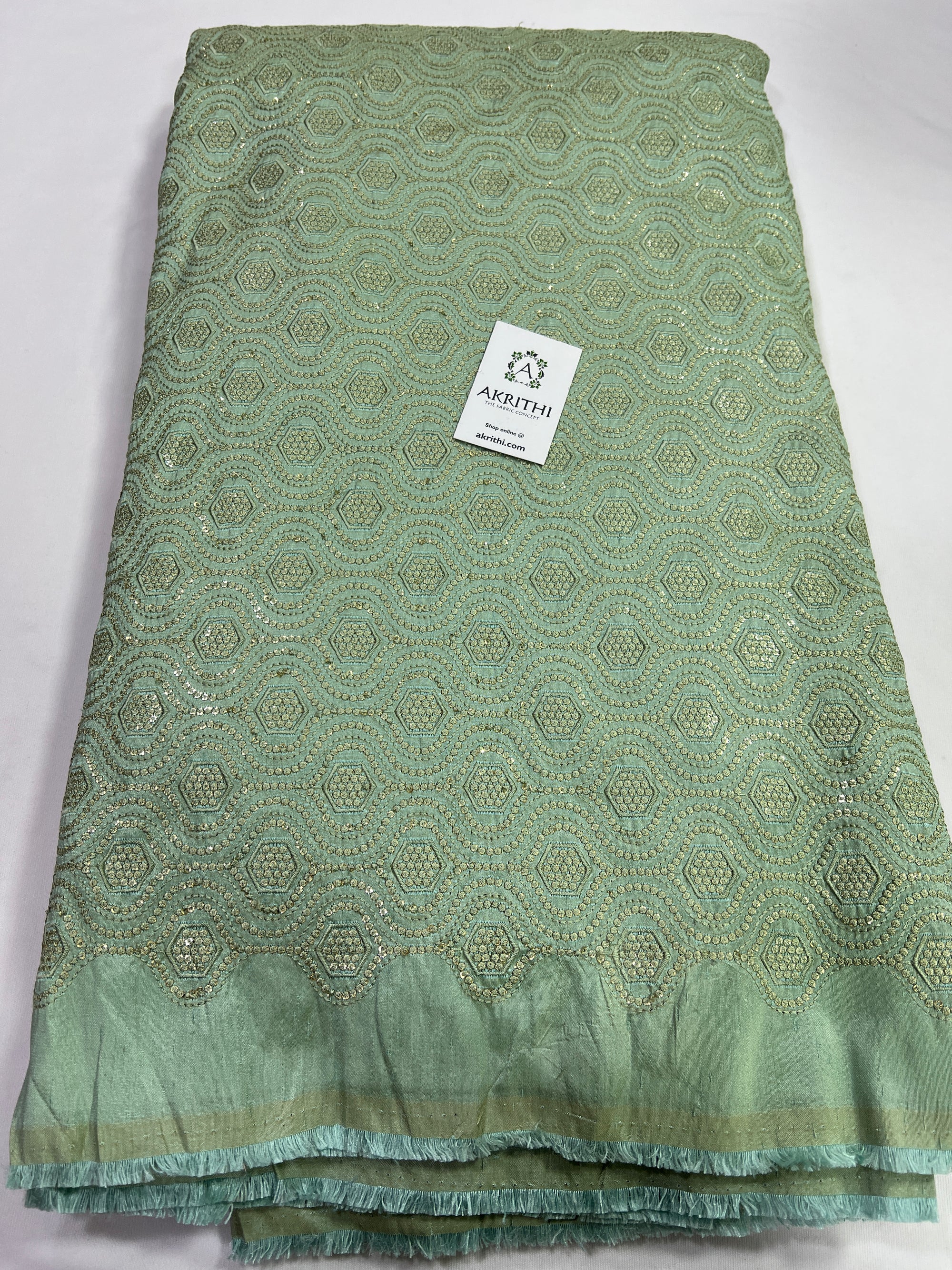 Heavy Embroidery on sea green raw silk fabric
