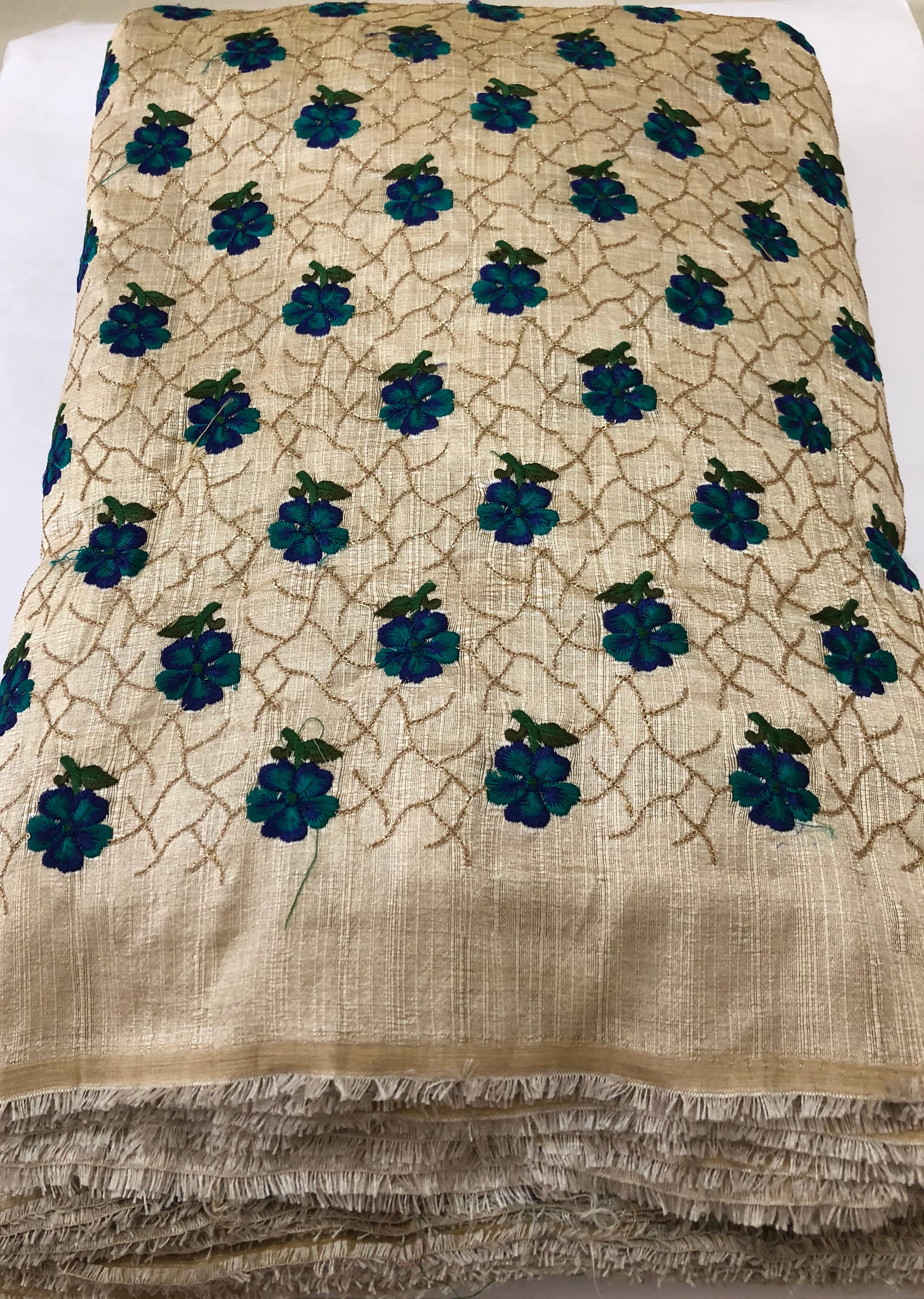 Thread and sequins embroidery on beige raw silk blouse