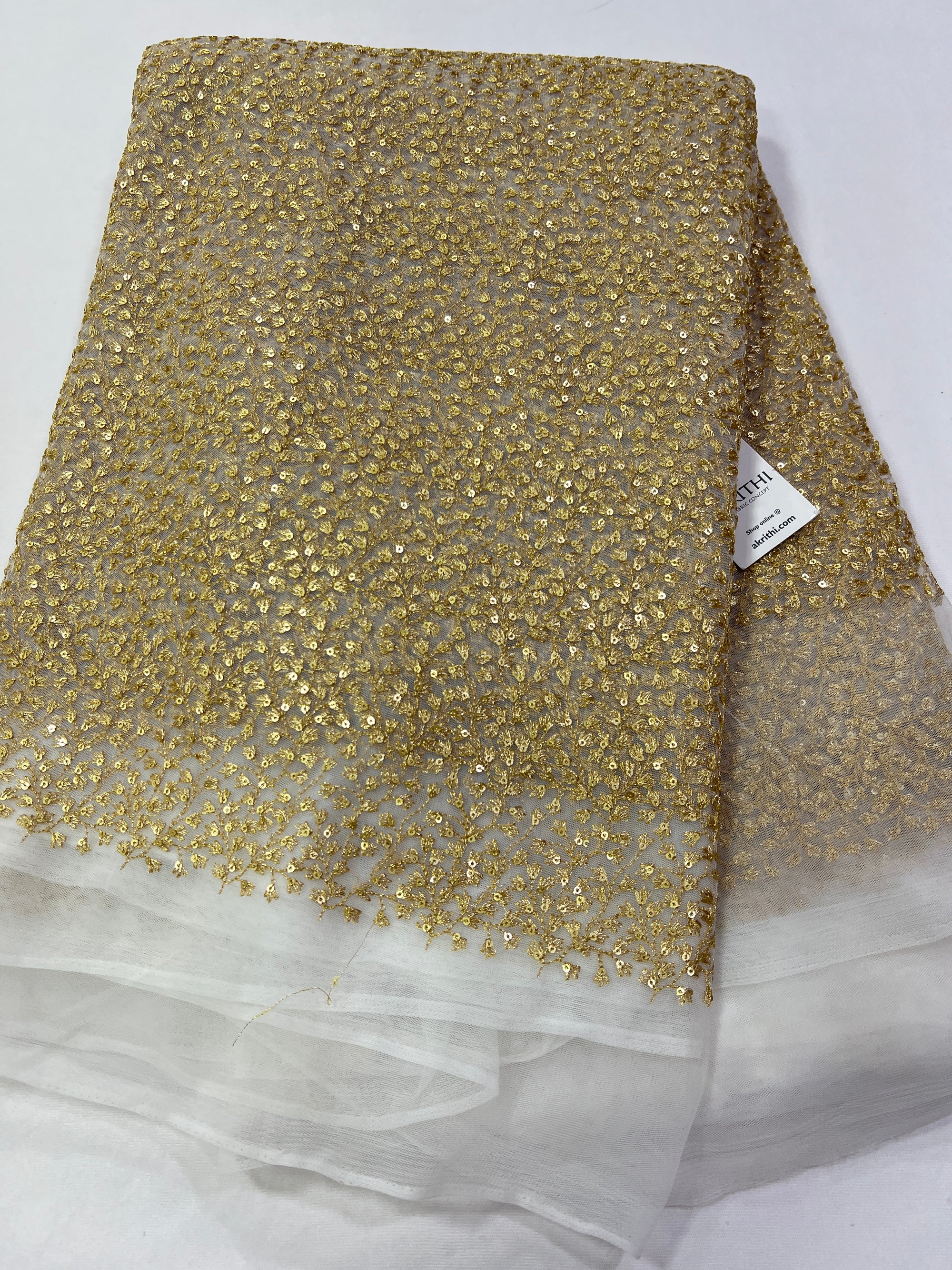 Gold Zari Embroidery on white net fabric
