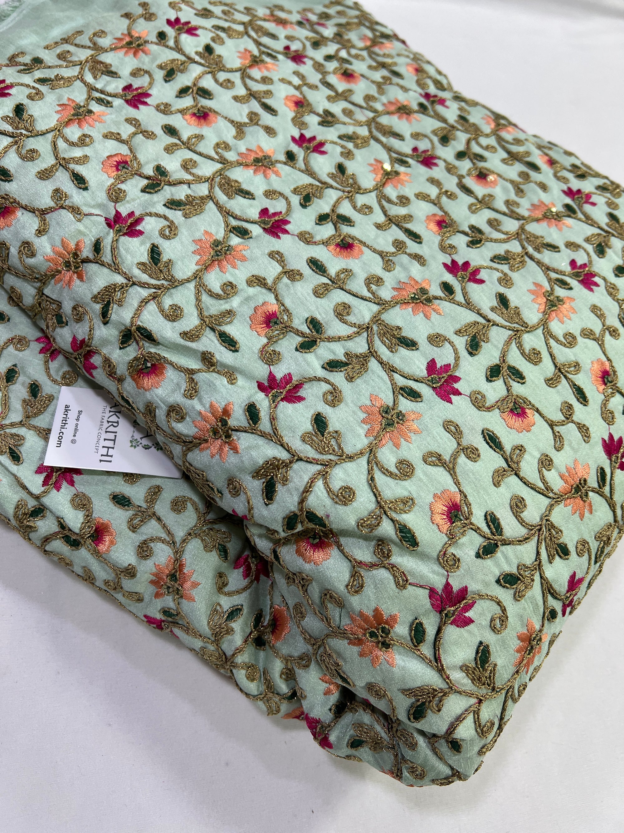 Embroidery on raw silk fabric