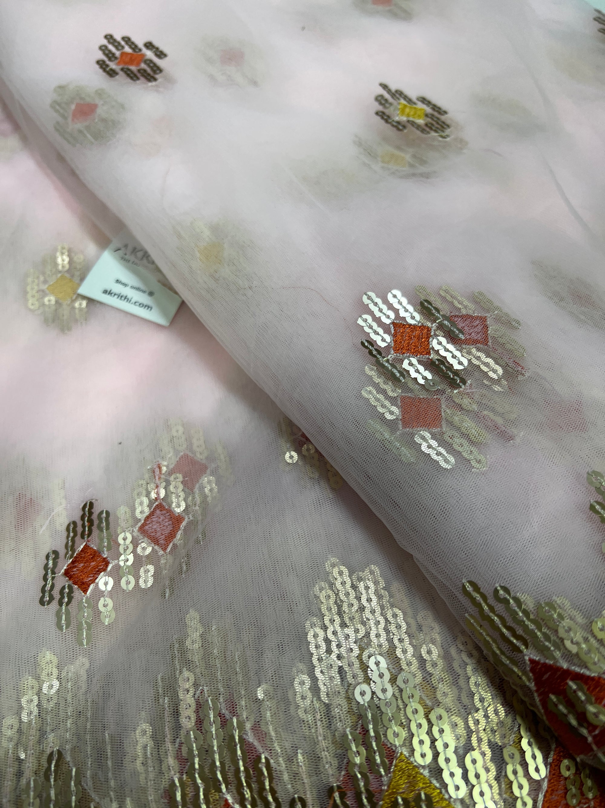 Embroidery on net fabric