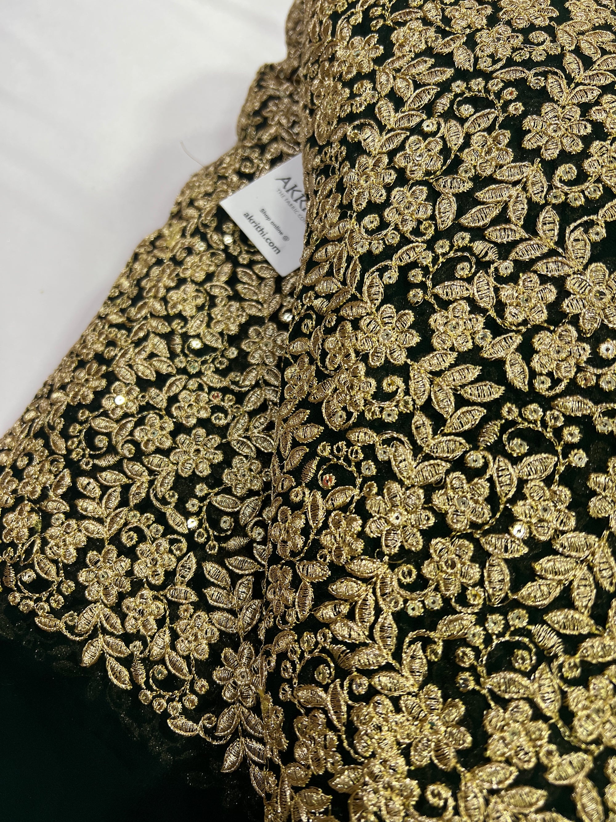 Embroidery on dark green georgette fabric
