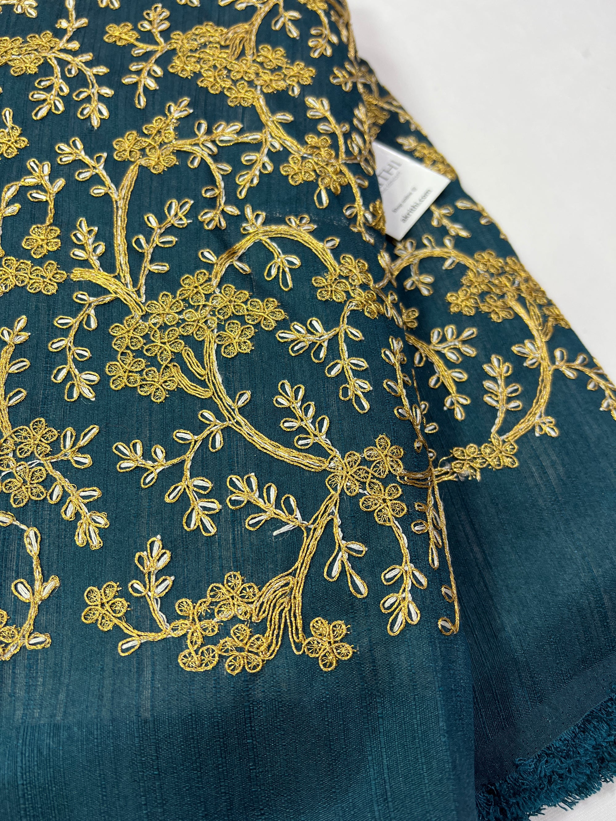 Embroidery on raw silk fabric