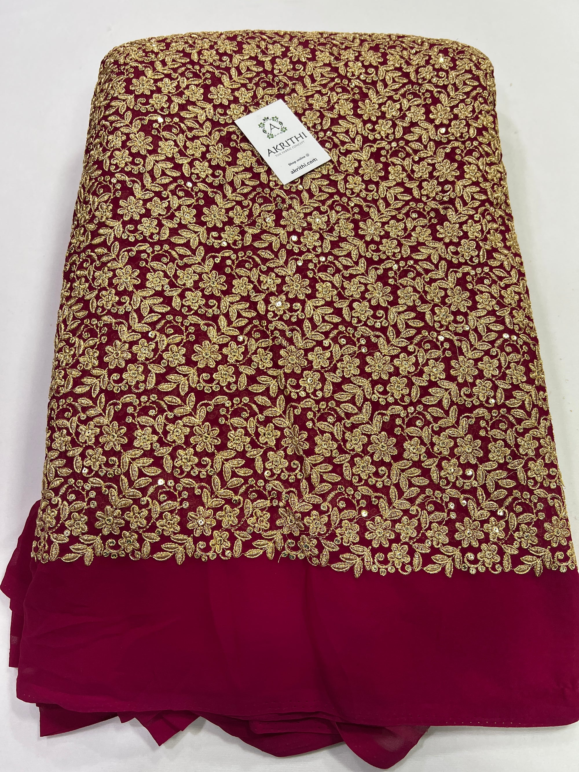 Embroidery on pink georgette fabric