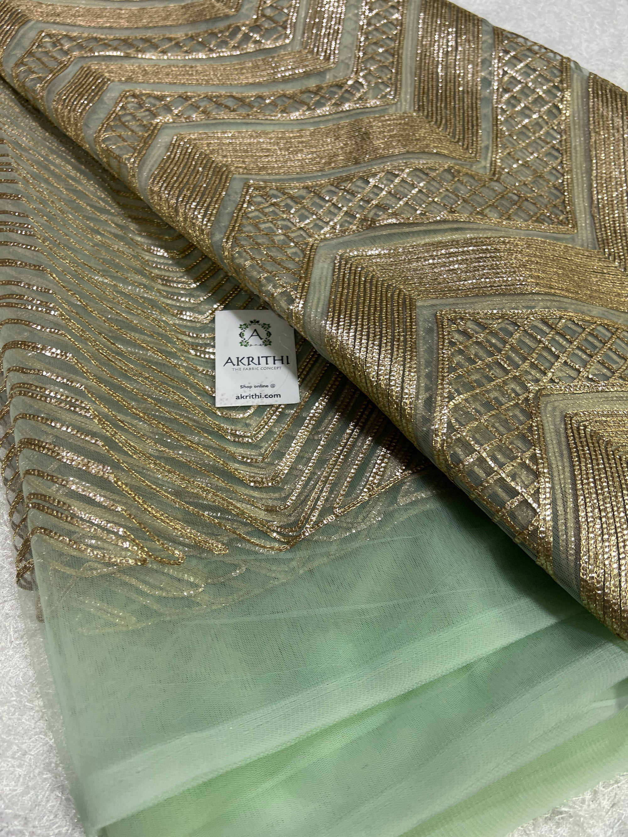 Embroidery on net fabric