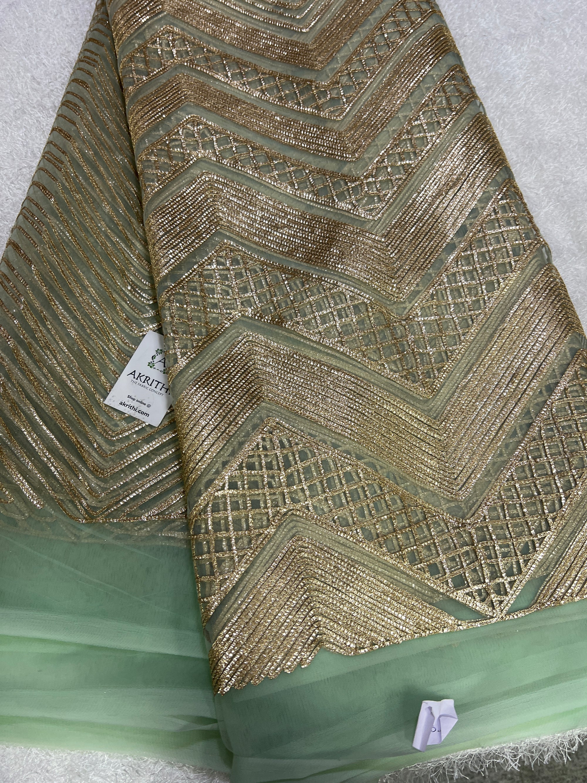 Embroidery on net fabric