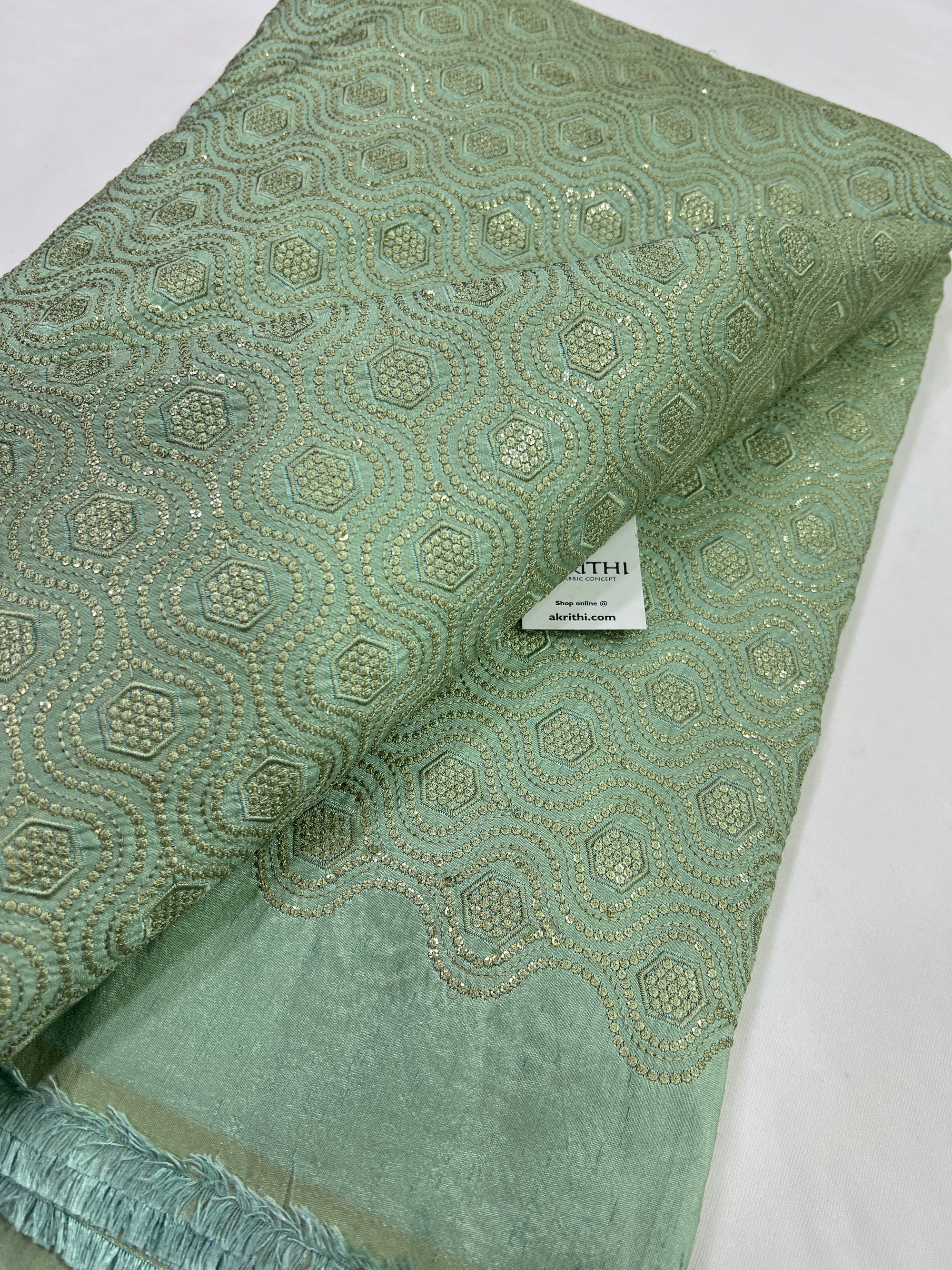 Heavy Embroidery on sea green raw silk fabric