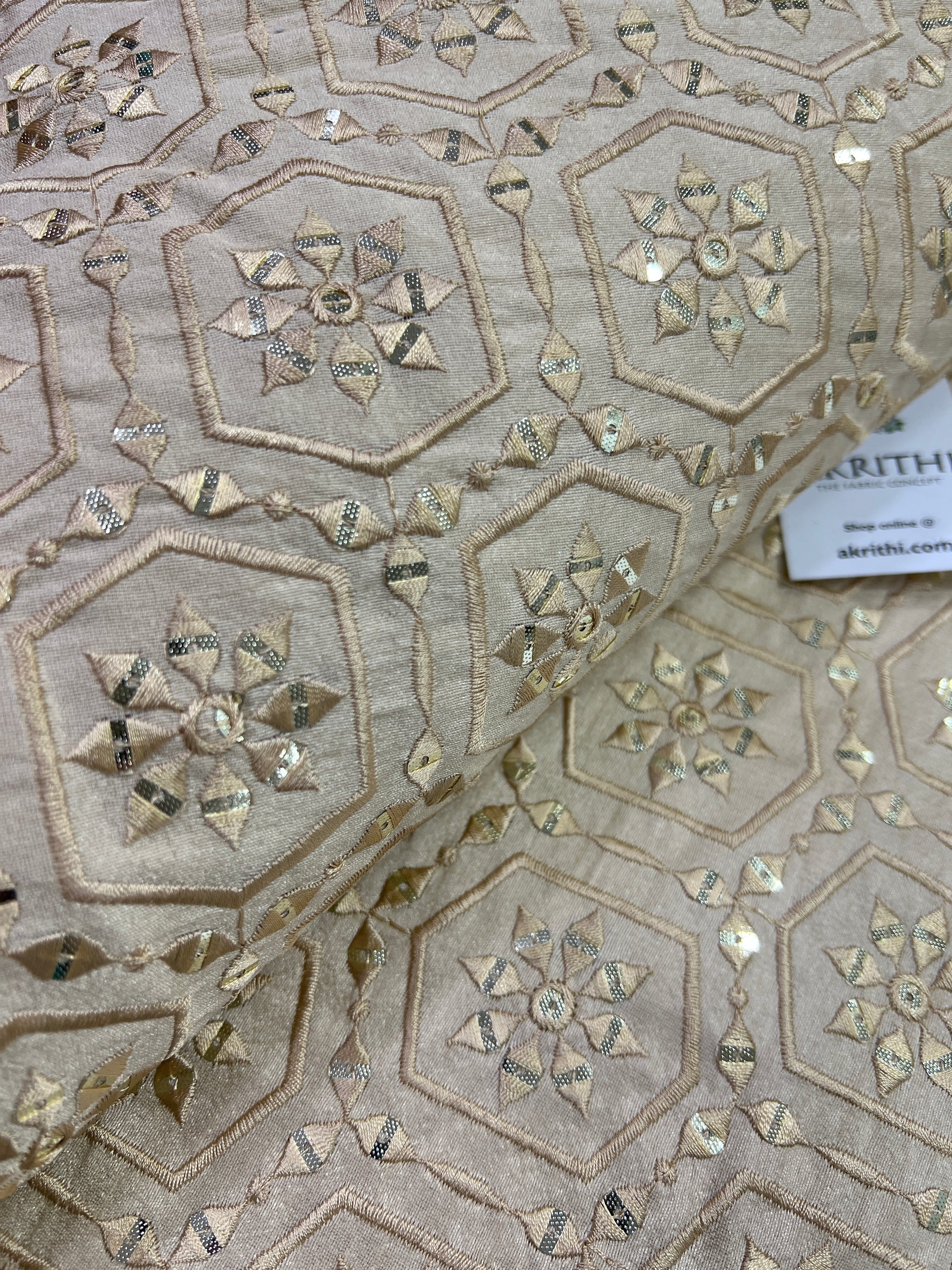 Embroidery on raw silk fabric