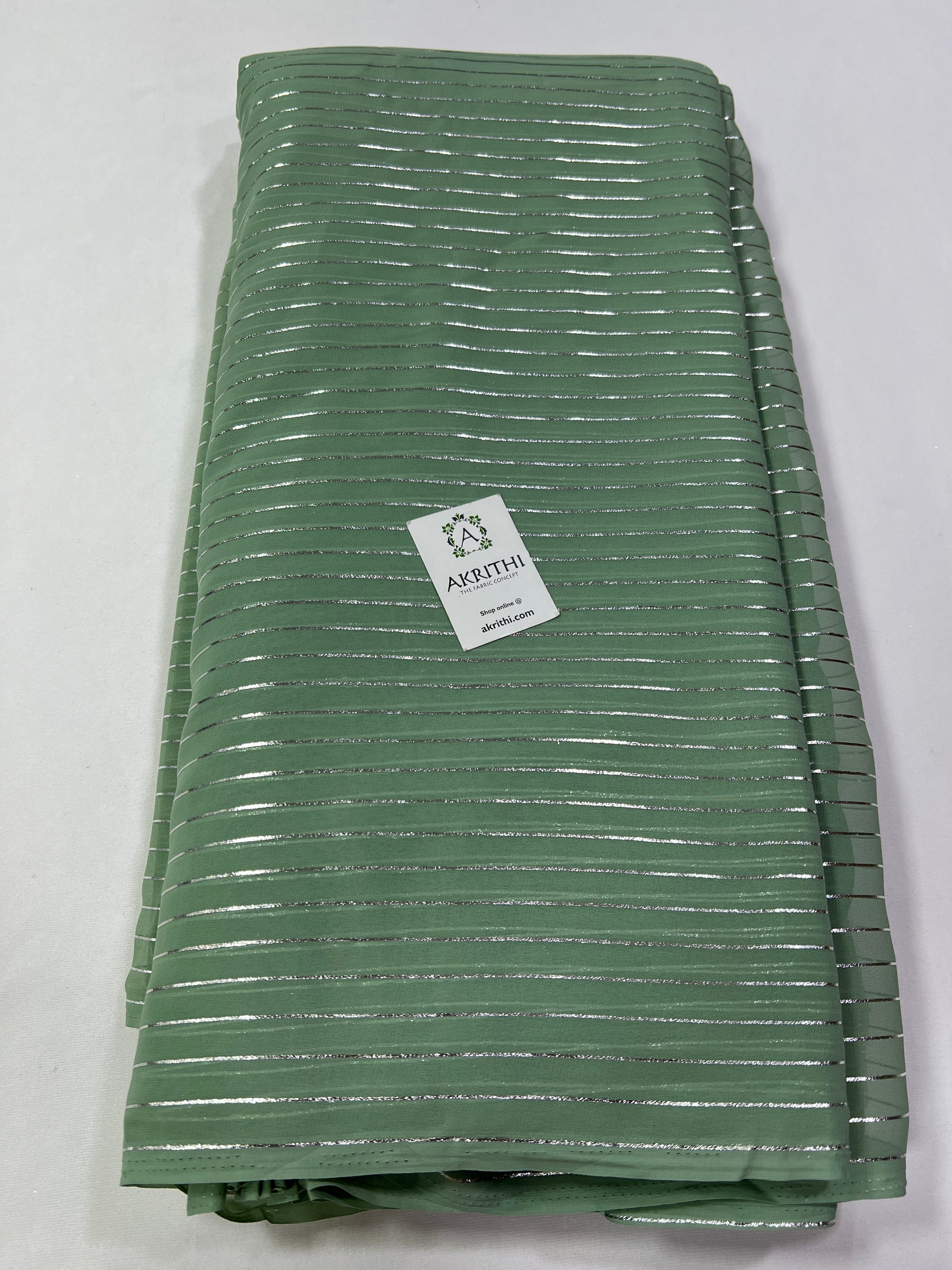 Foil printed slate green georgette fabric