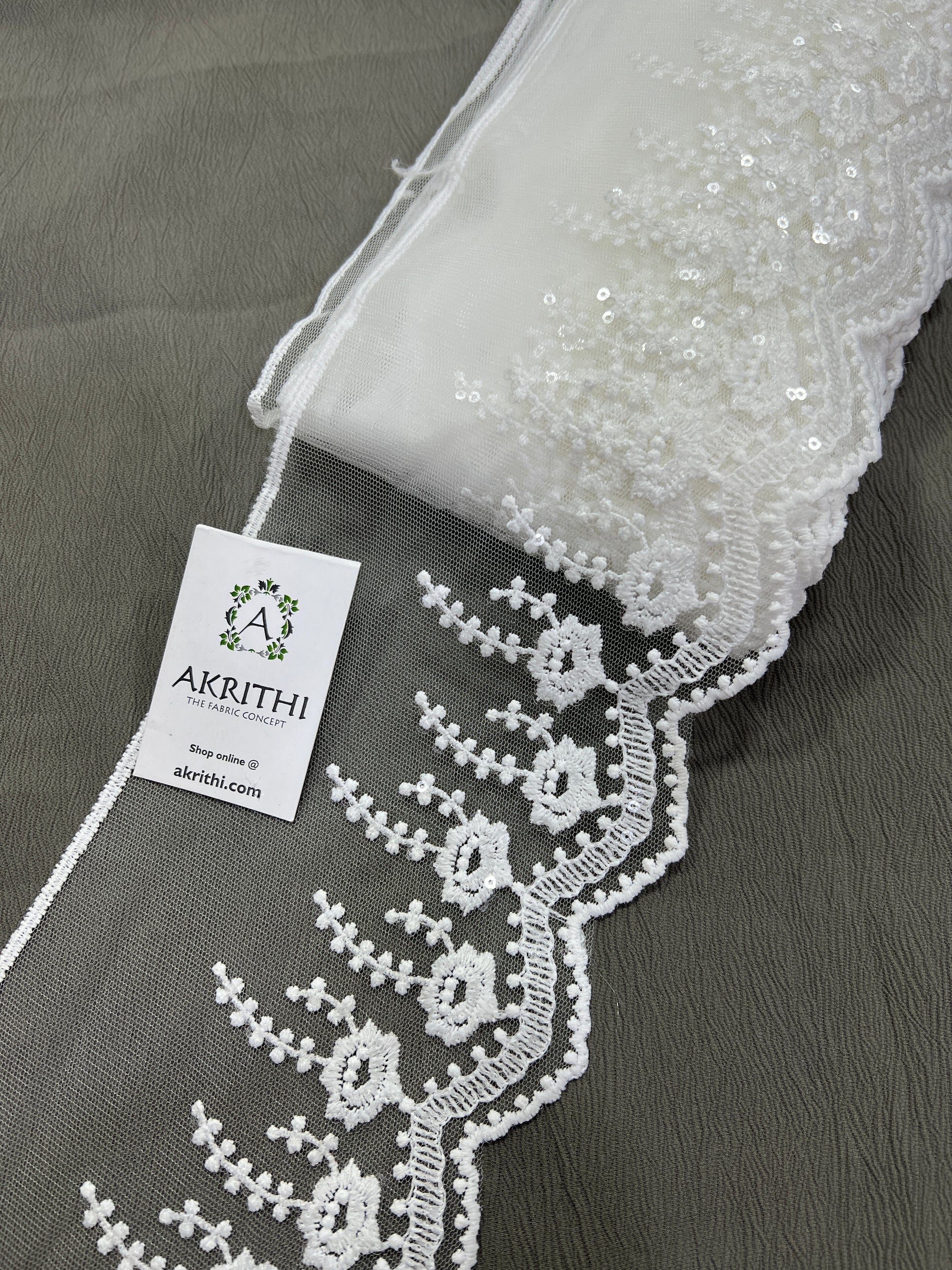 Embroidered white net lace 9 metres roll