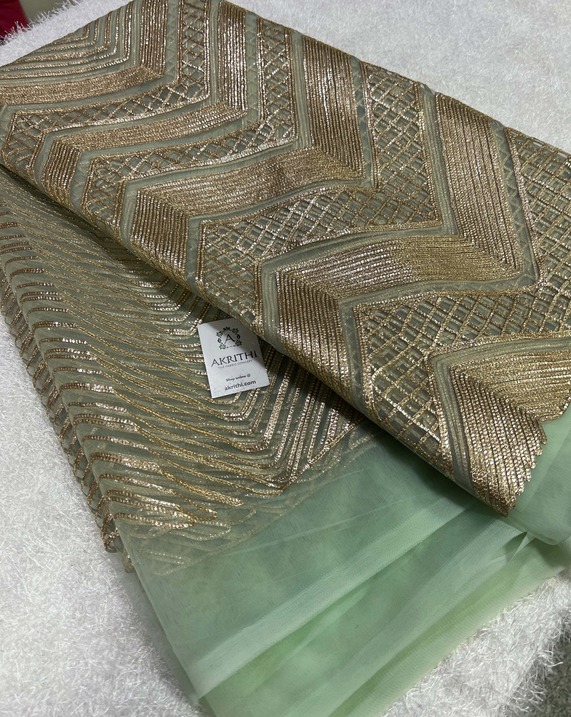 Embroidery on net fabric