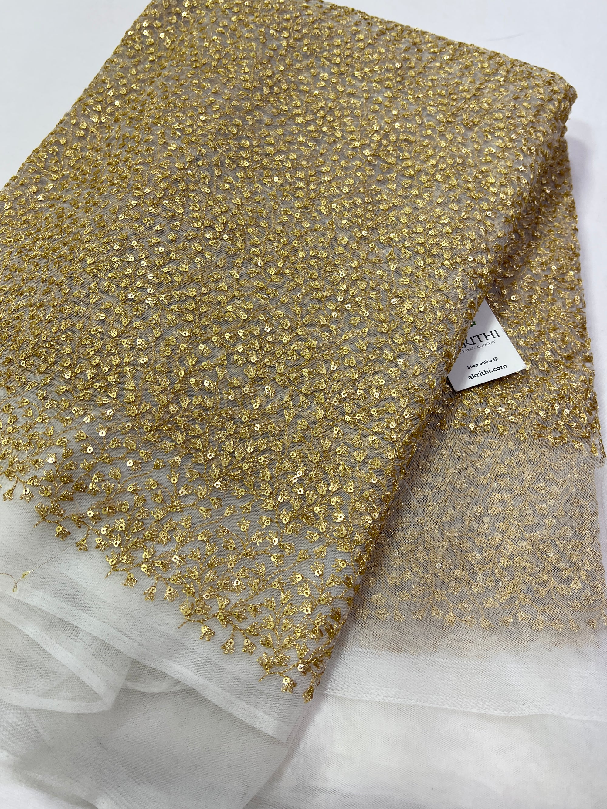 Gold Zari Embroidery on white net fabric