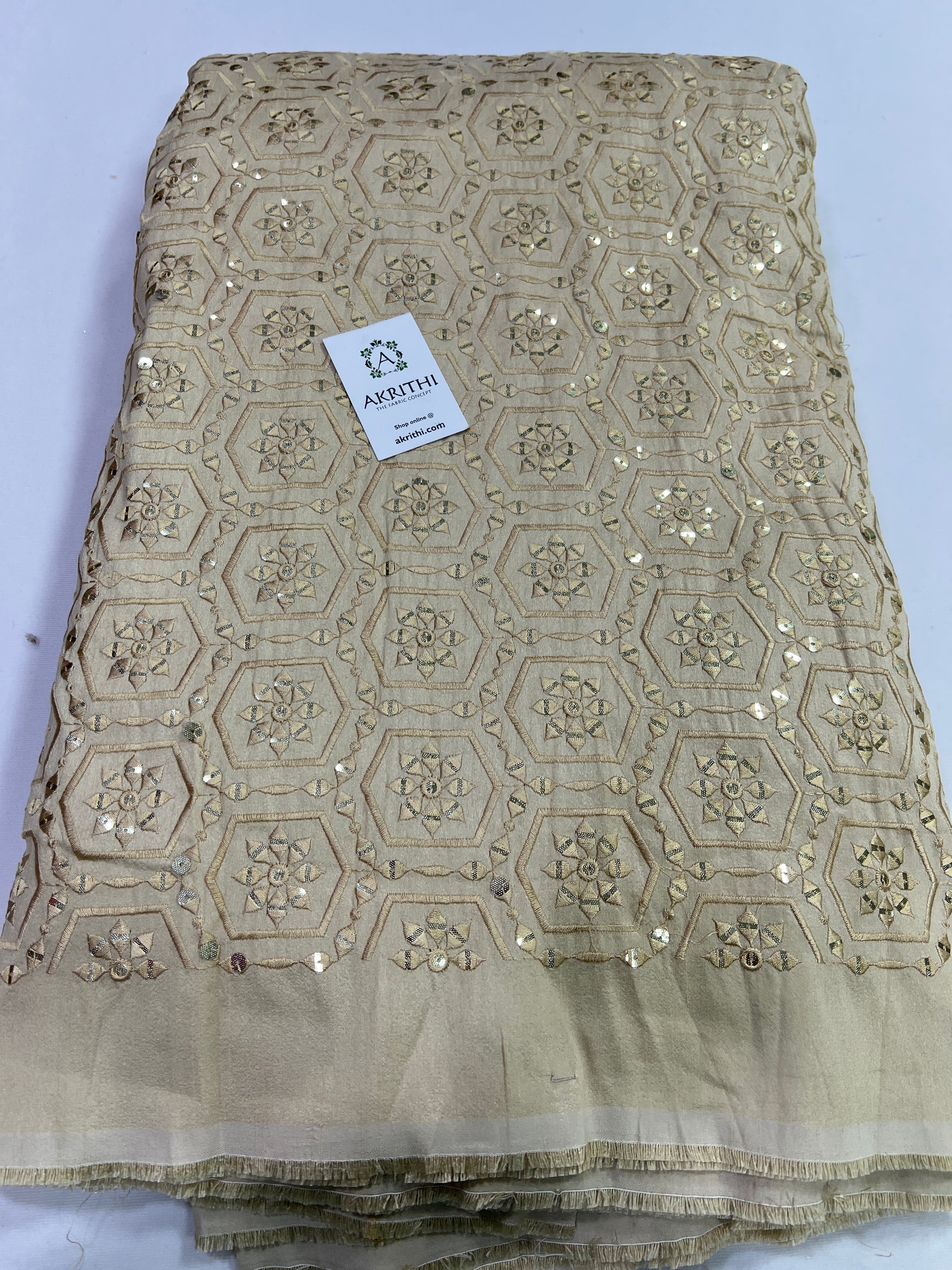 Embroidery on raw silk fabric