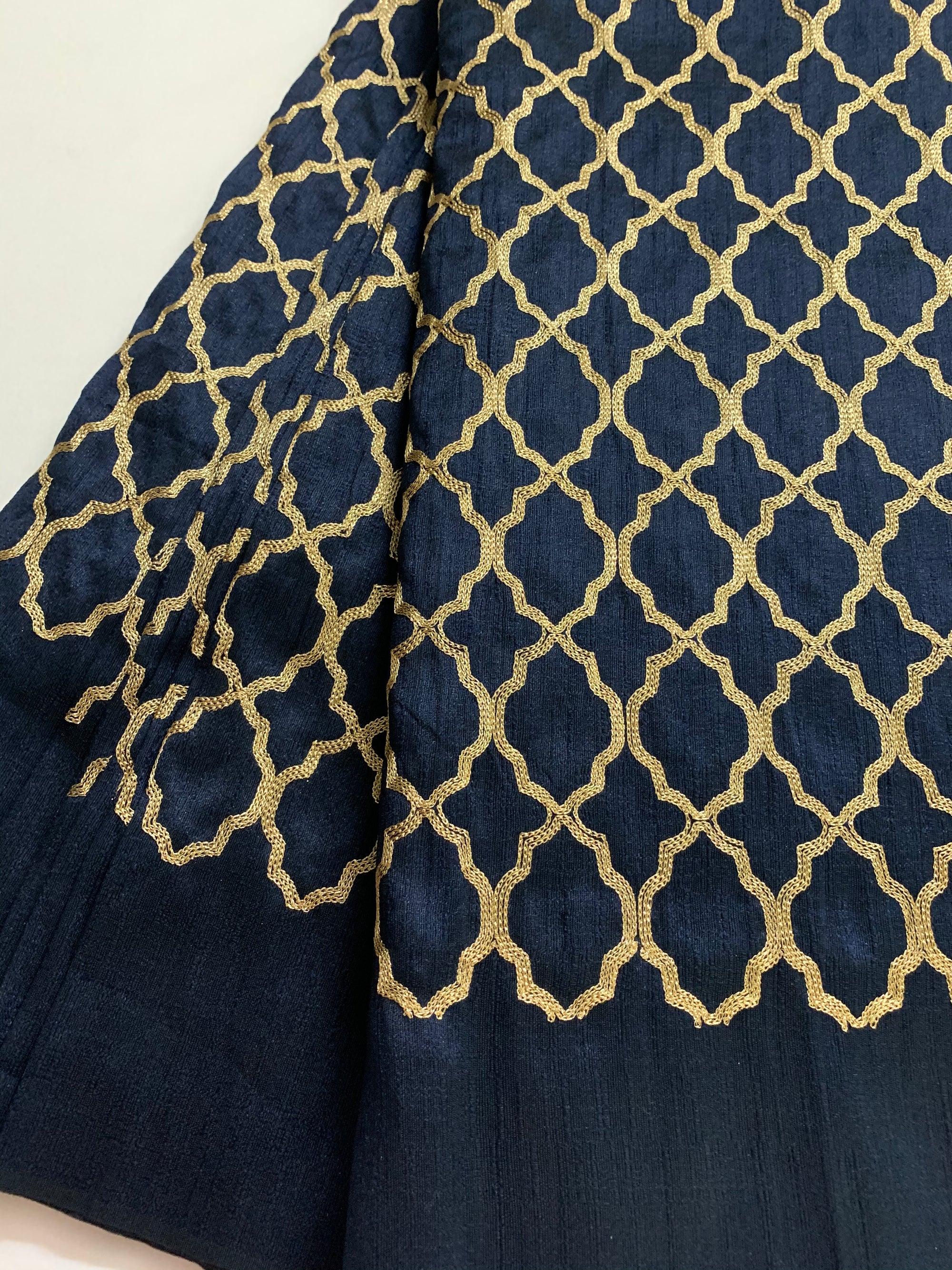 Embroidery on navy blue raw silk fabric