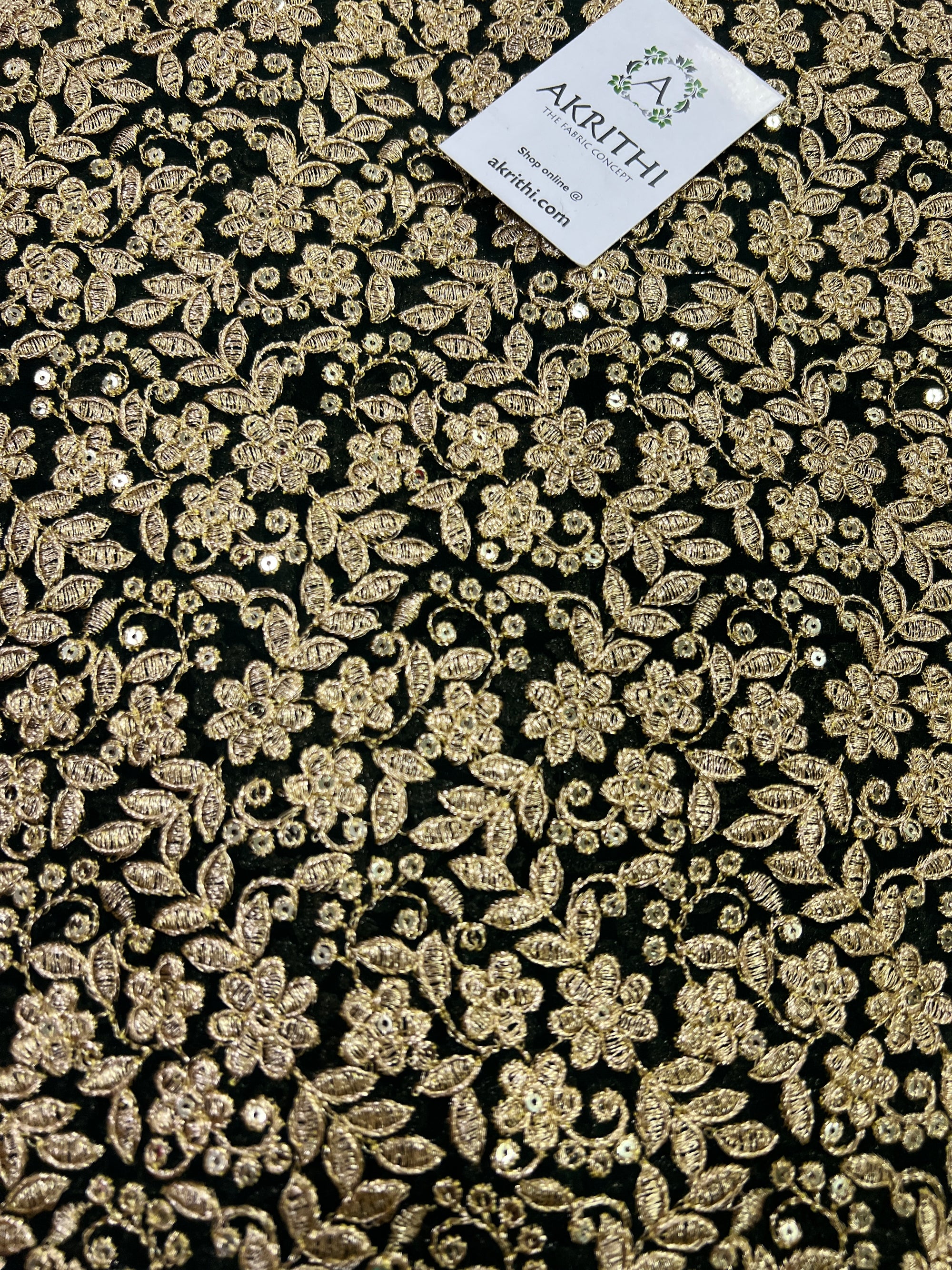 Embroidery on dark green georgette fabric