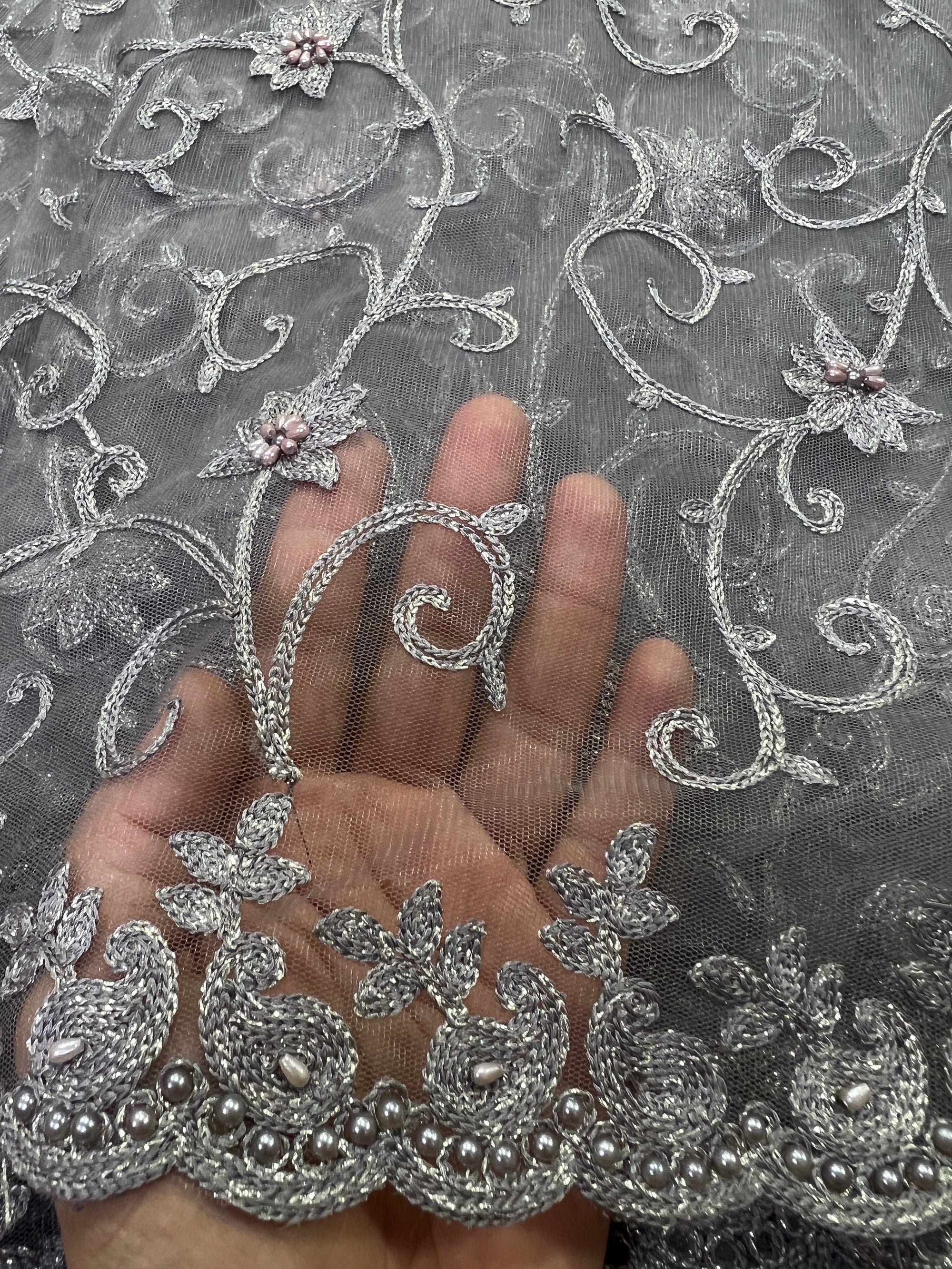 Embroidery on net fabric