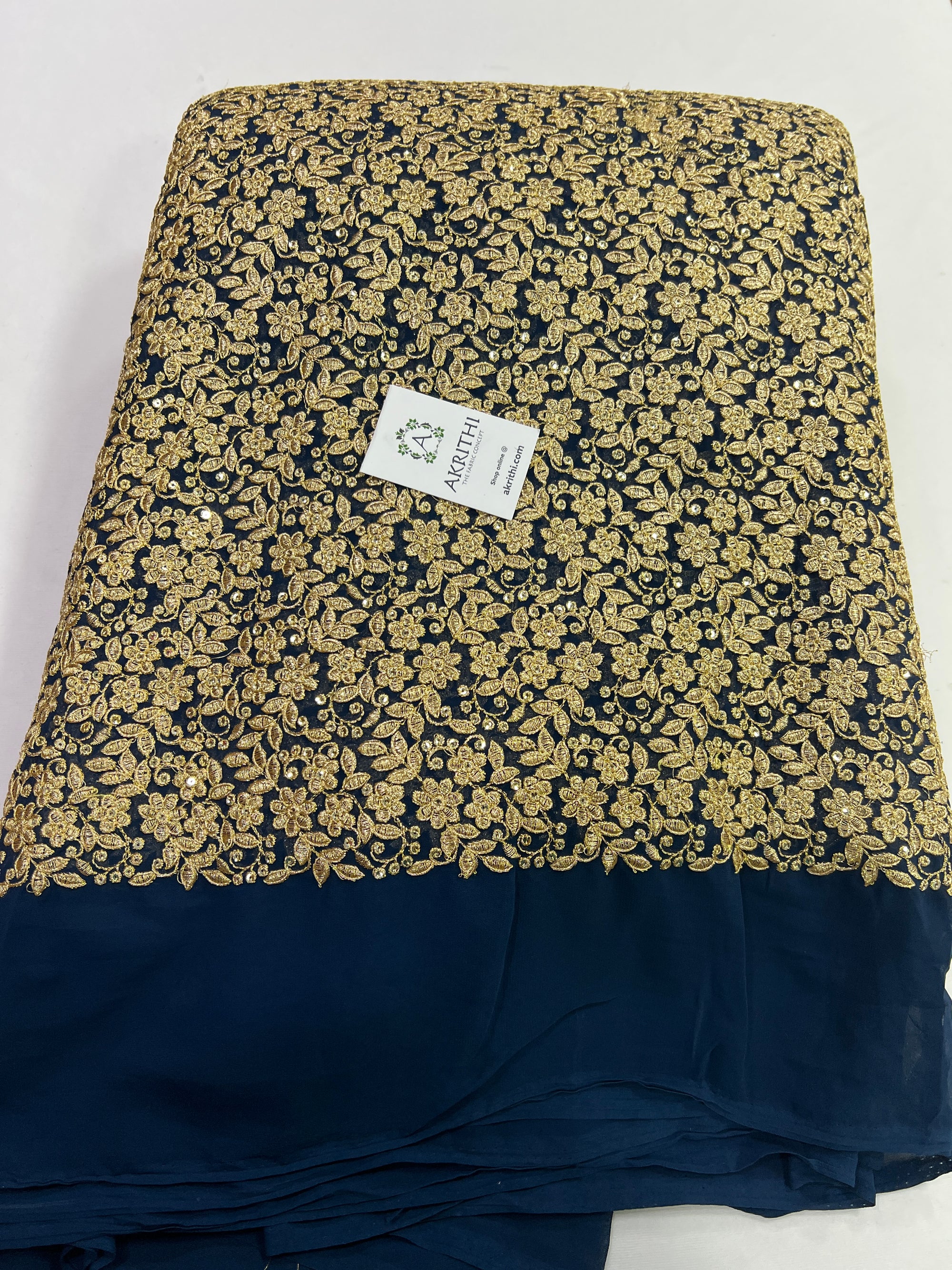 Embroidery on peacock blue georgette fabric