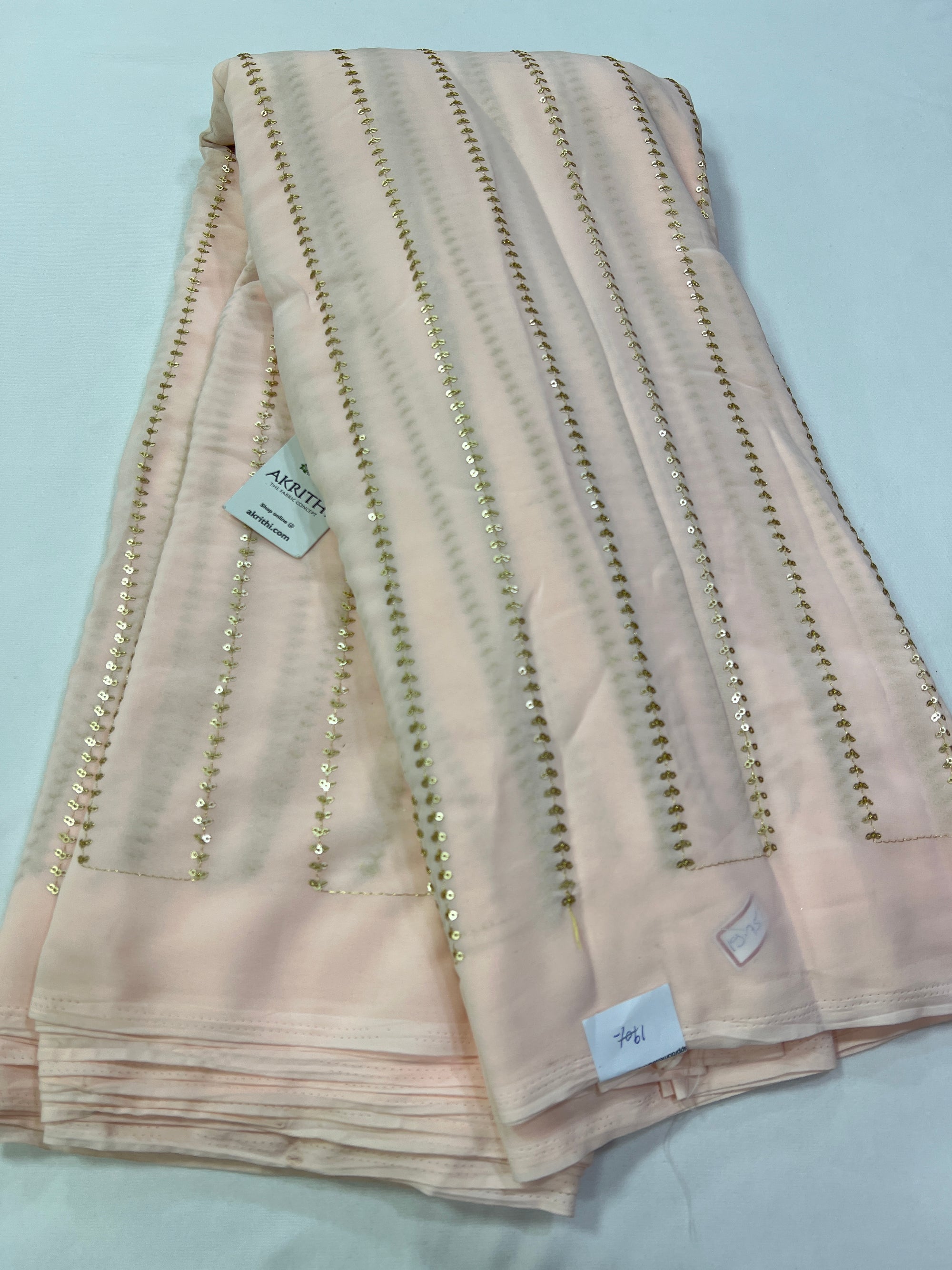 Embroidery on Peach Georgette fabric