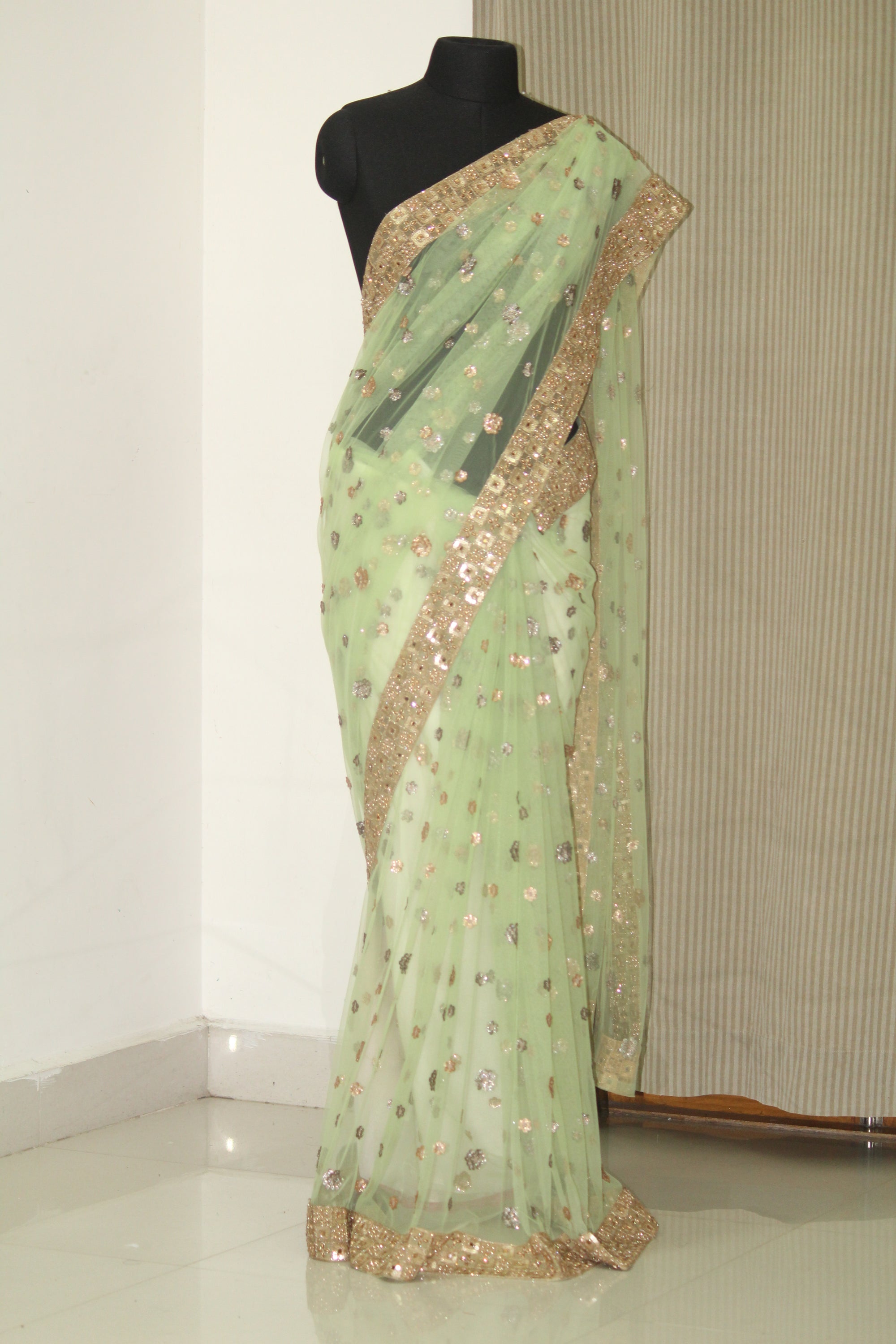 Green net butti saree