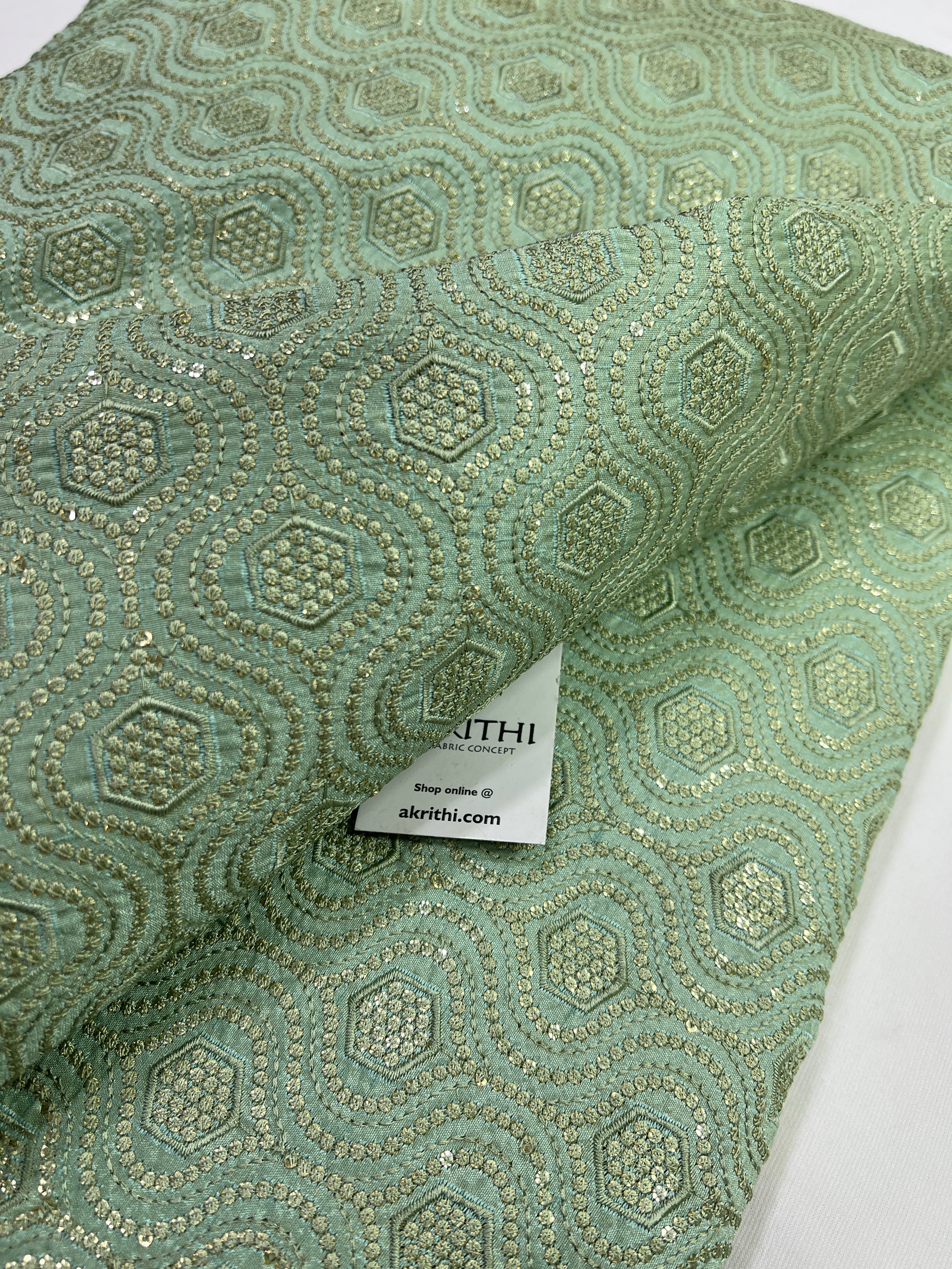 Heavy Embroidery on sea green raw silk fabric