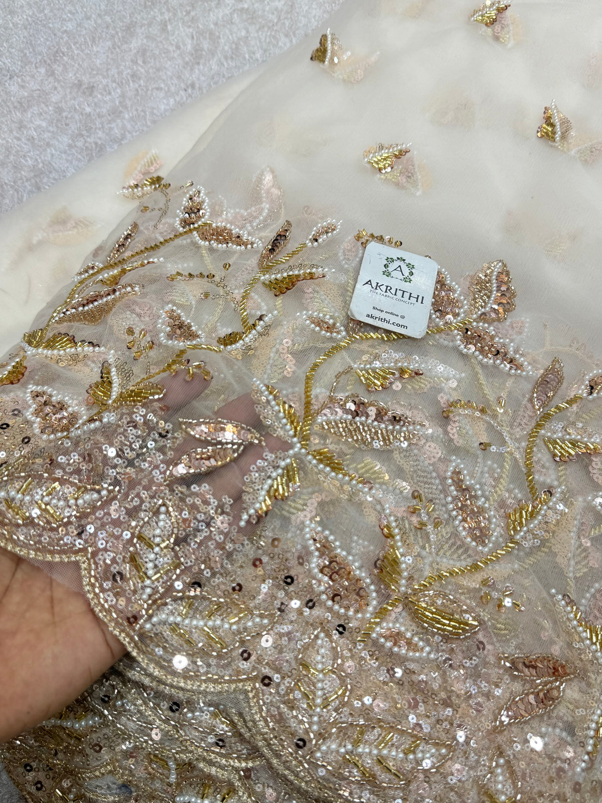 Embroidered net fabric
