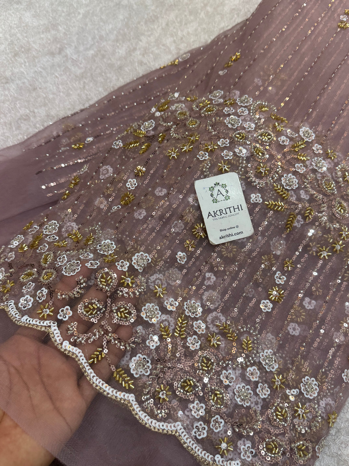 Embroidered net fabric