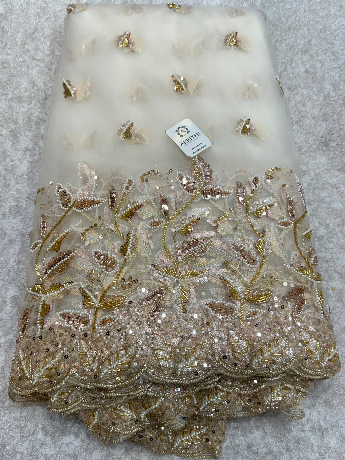 Embroidered net fabric