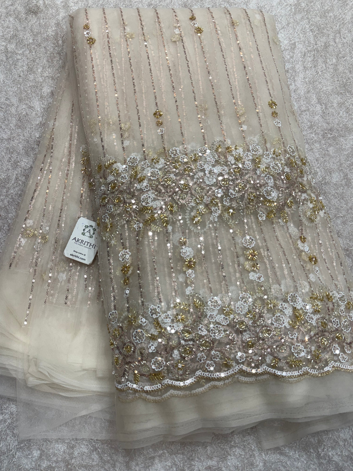 Embroidered net fabric