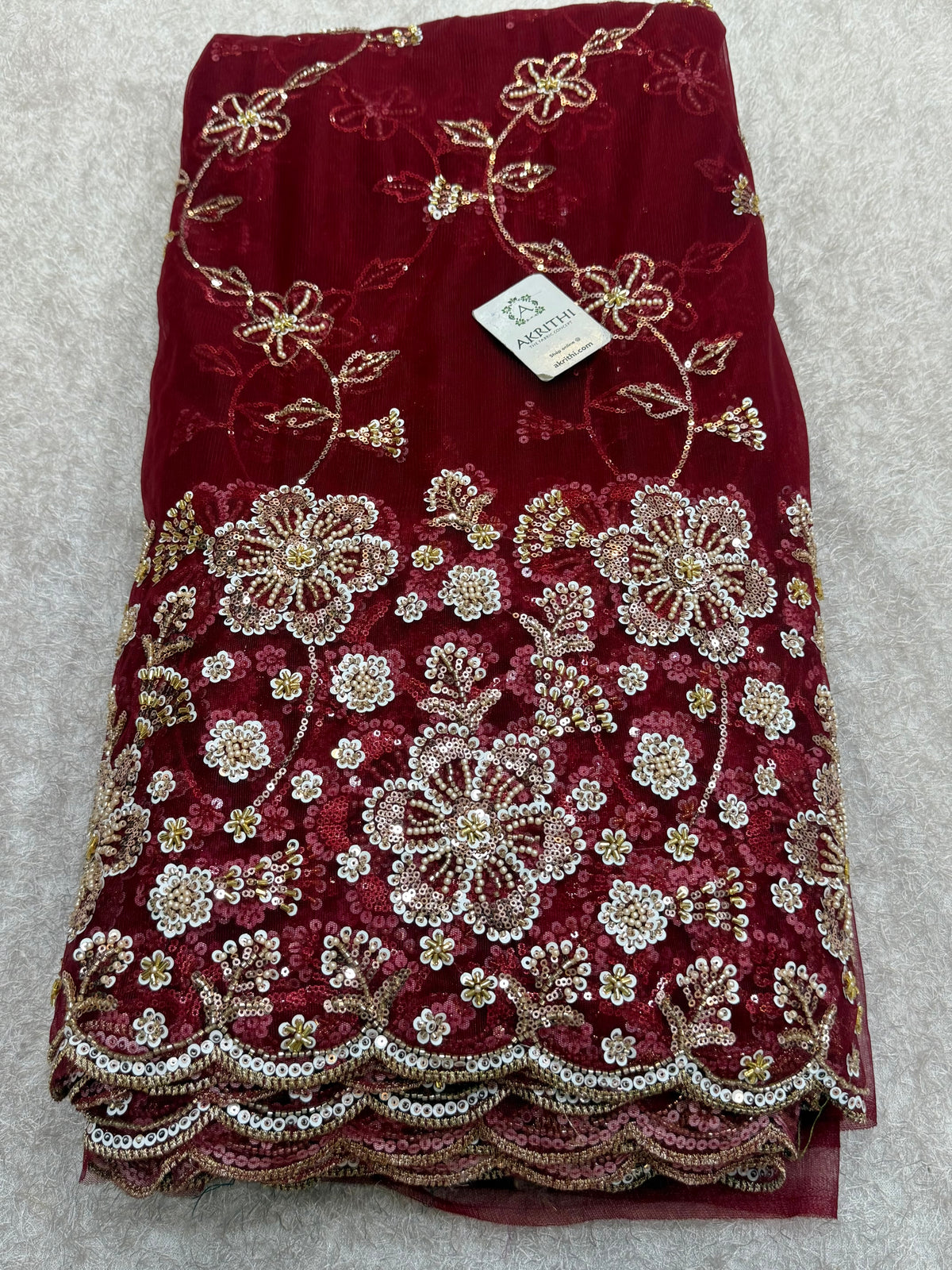 Embroidered net fabric