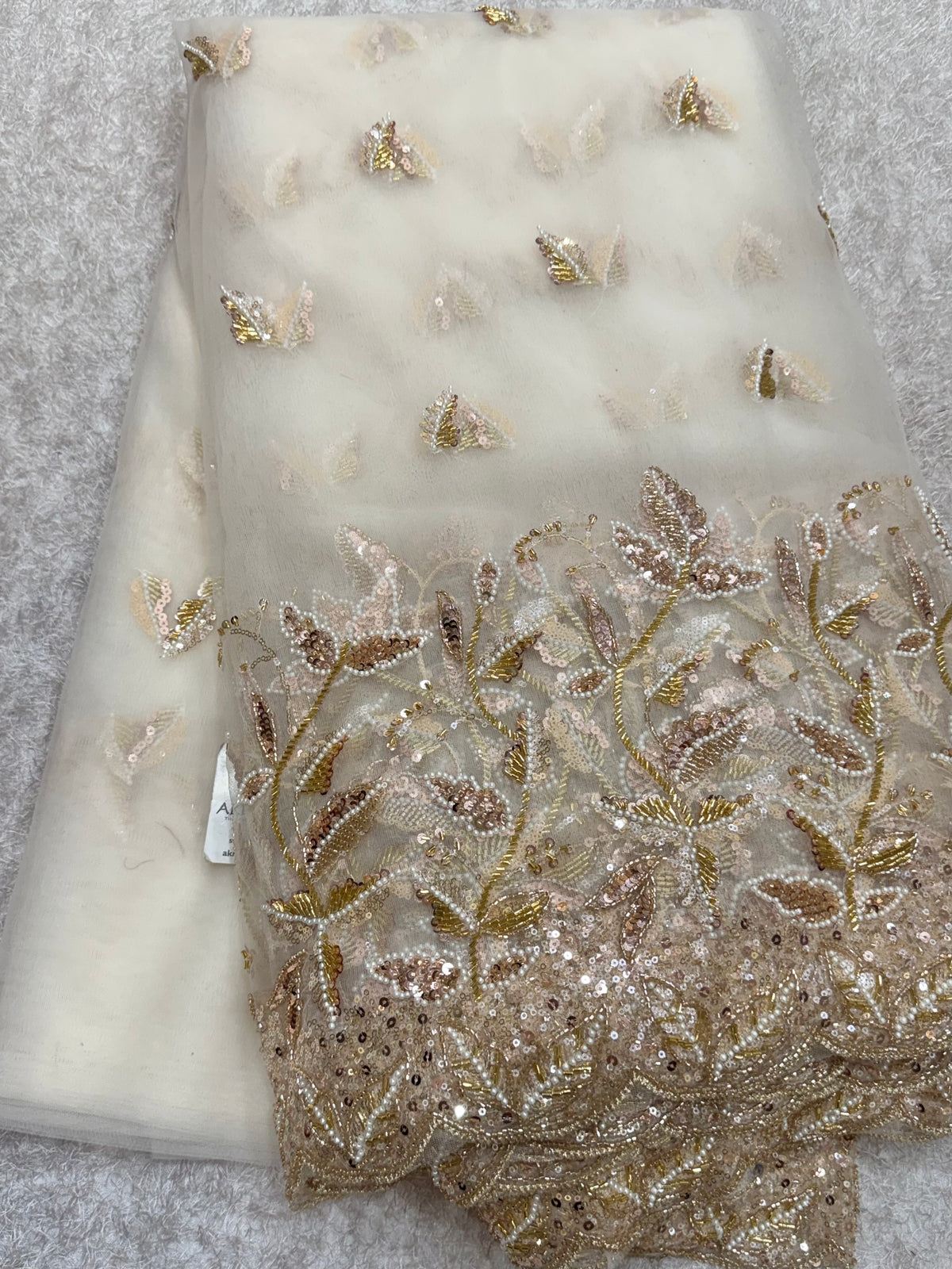 Embroidered net fabric