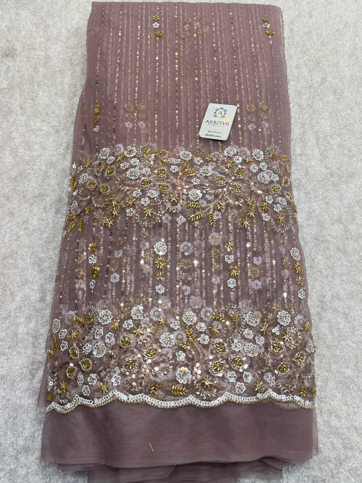 Embroidered net fabric