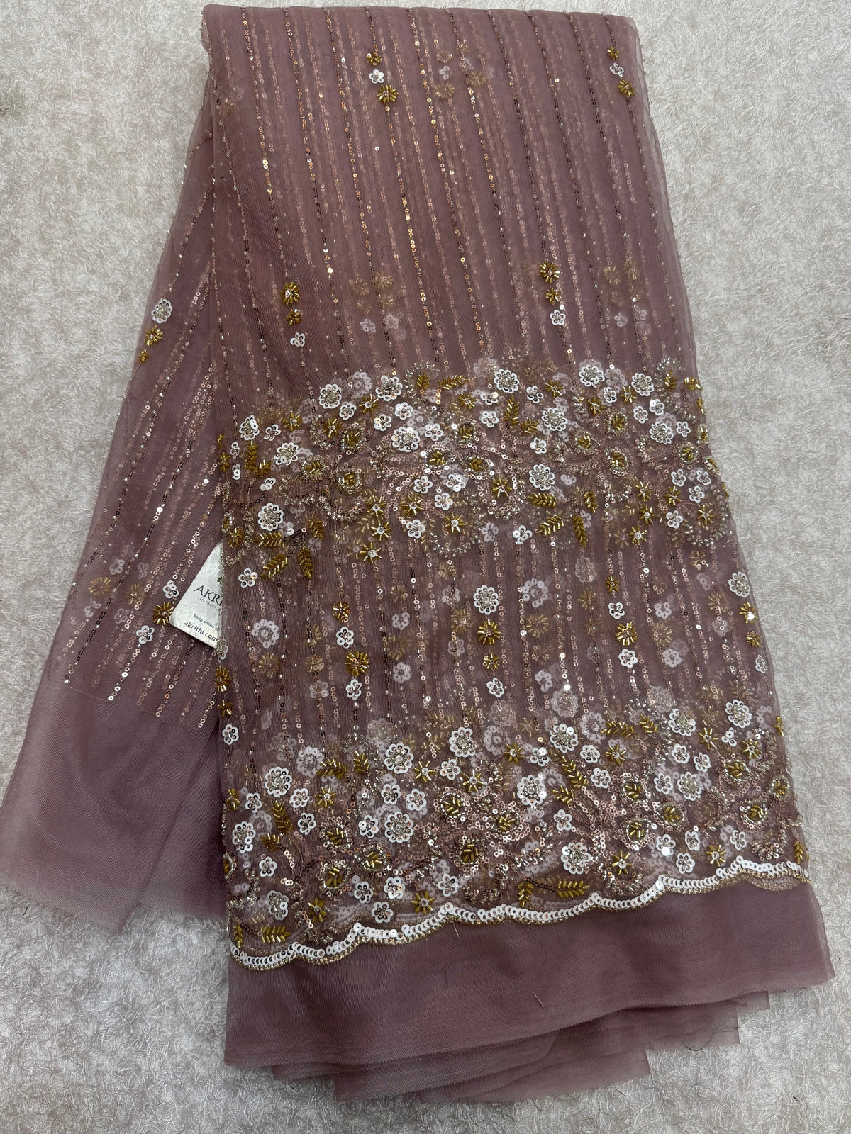 Embroidered net fabric