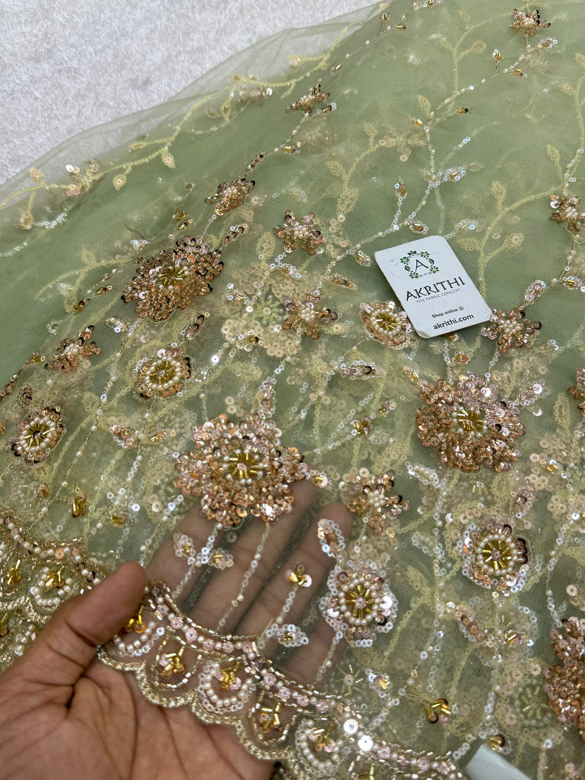 Embroidered net fabric