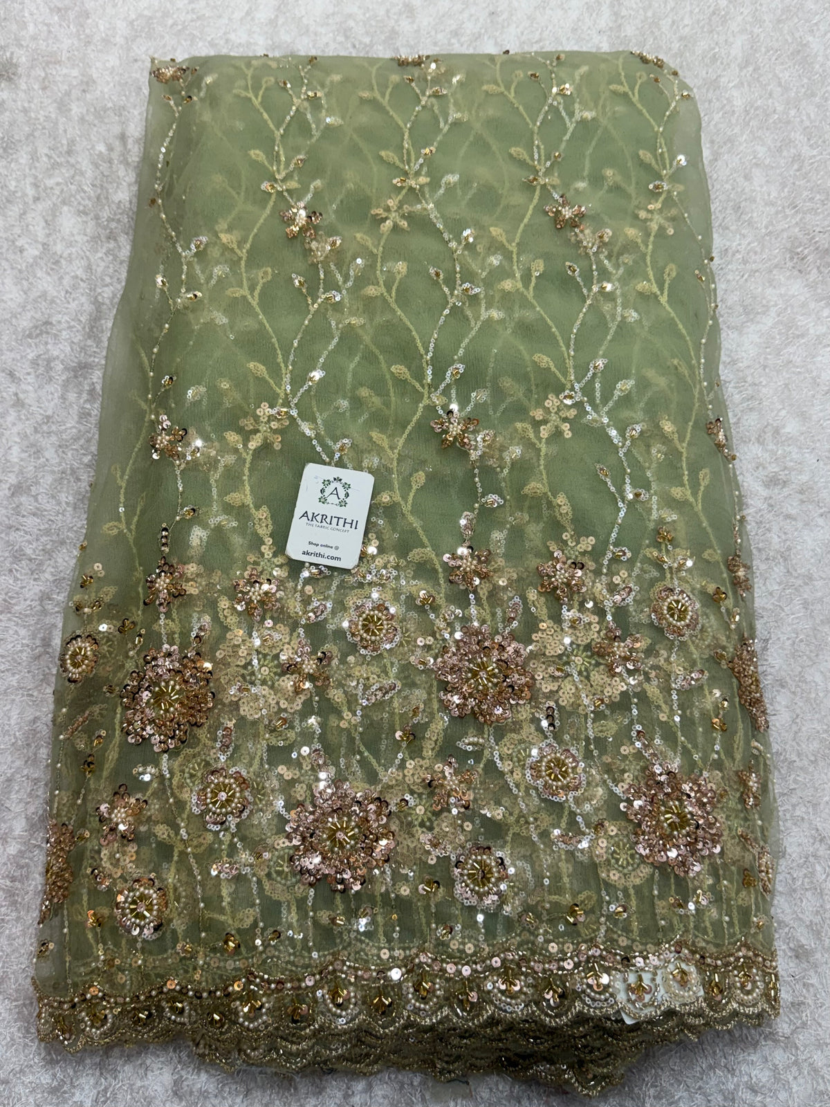 Embroidered net fabric