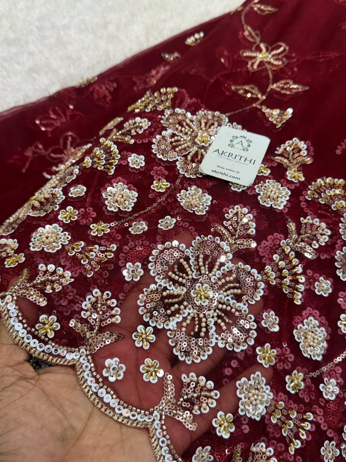 Embroidered net fabric
