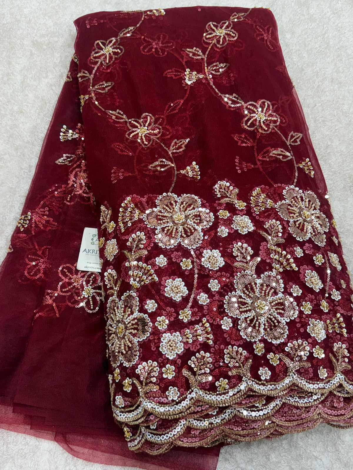 Embroidered net fabric